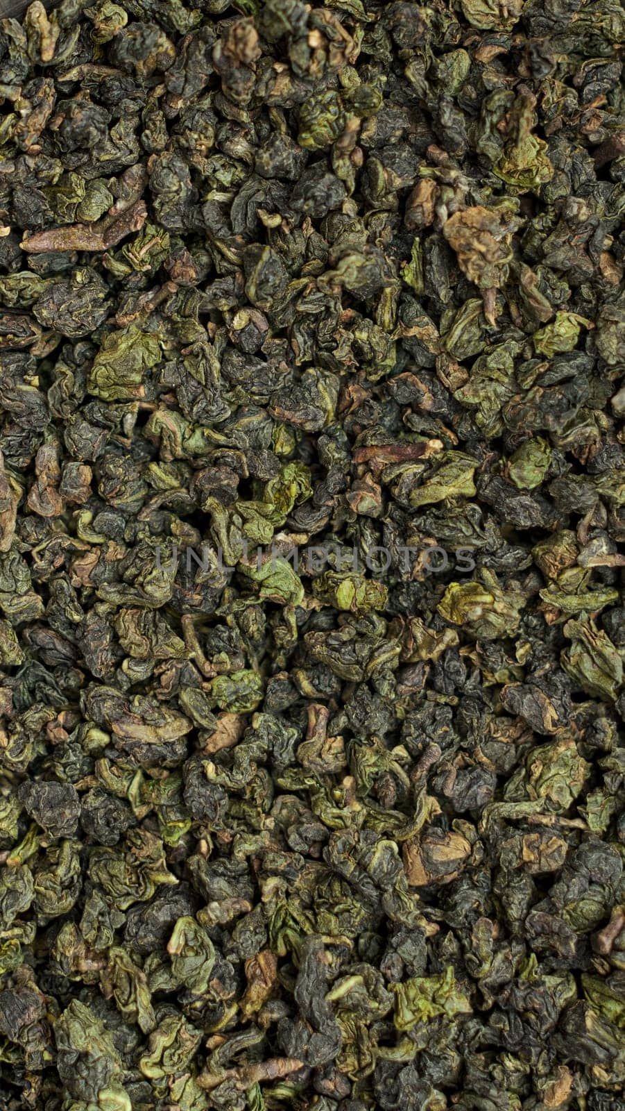 A captivating view of various dried green tea leaves highlighting their rich textures and vibrant colors