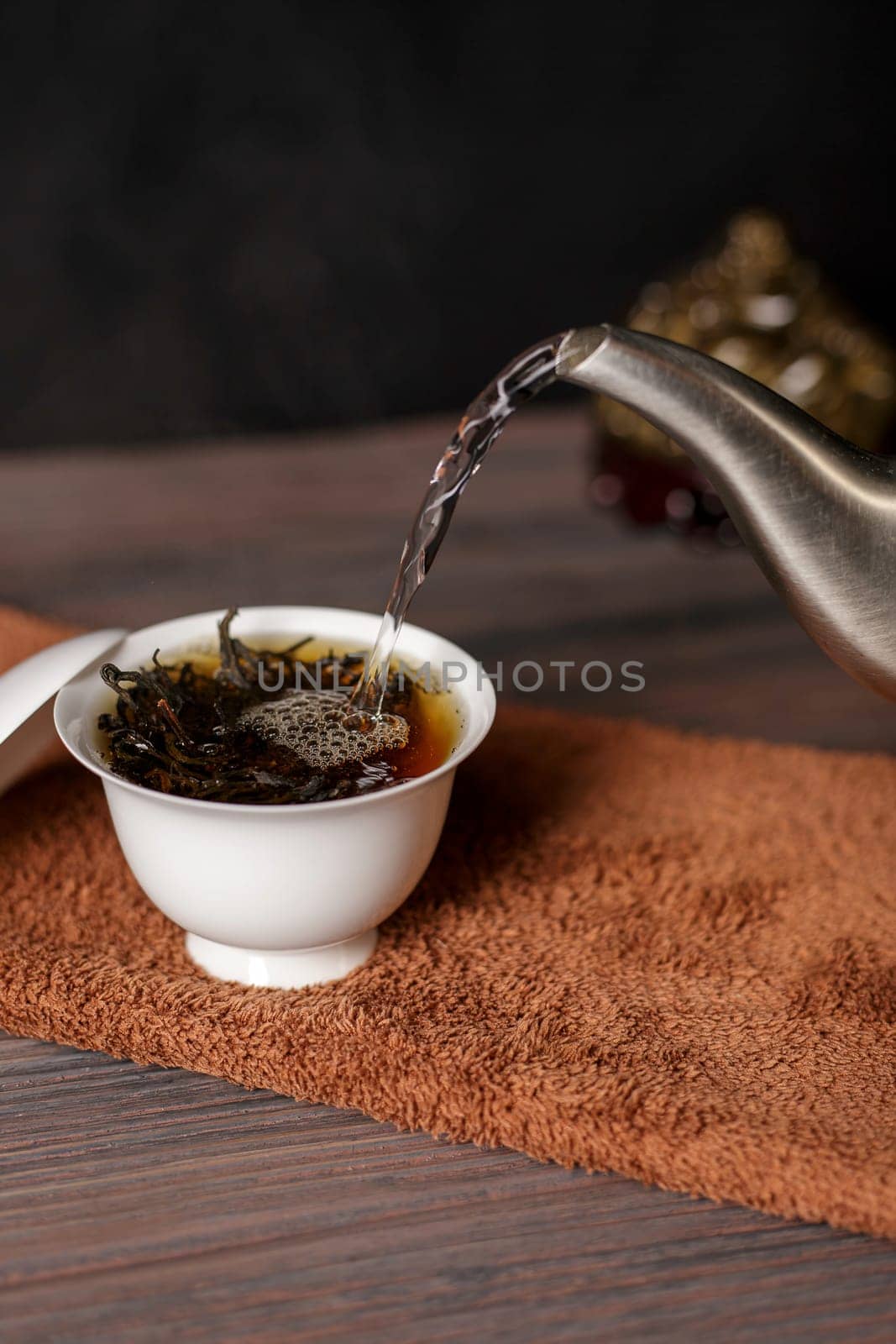 A beautifully serene scene of green tea being poured into a delicate cup, showcasing tea culture and tranquil moments