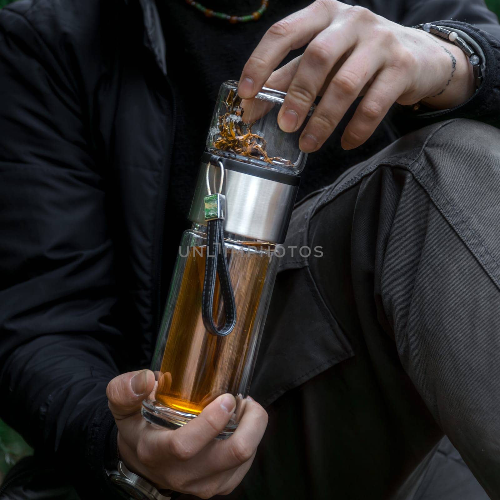 This stylish glass teapot showcases a vibrant and colorful herbal infusion, making it perfect for all tea lovers