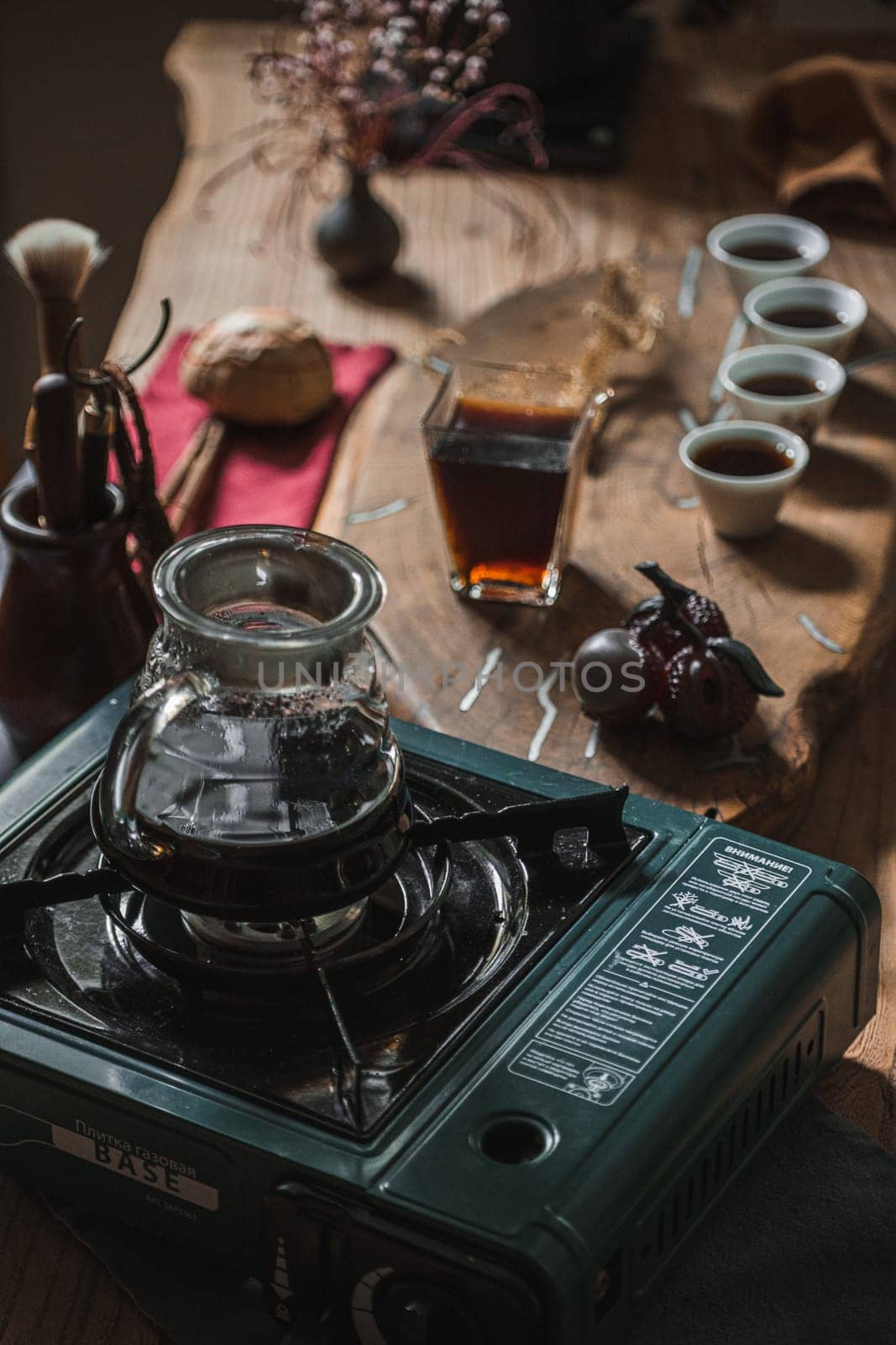 A cozy coffee brewing scene showcasing a vintage stove, delicate serveware, and the inviting aroma of fresh coffee