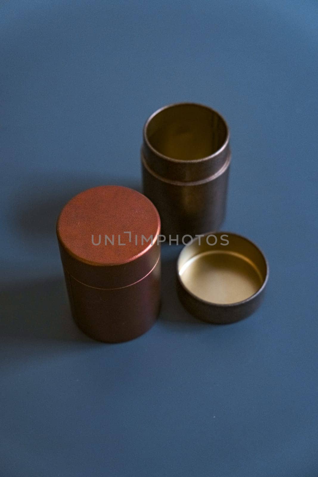 These elegant metal storage containers, featuring warm tones, are perfect for both organizing and enhancing home decor