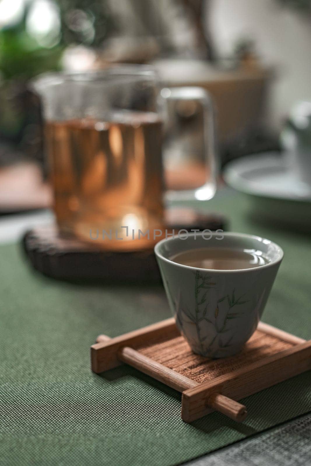 A beautifully tranquil tea setup showcasing a cup alongside a kettle, ideal for moments of relaxation and mindfulness