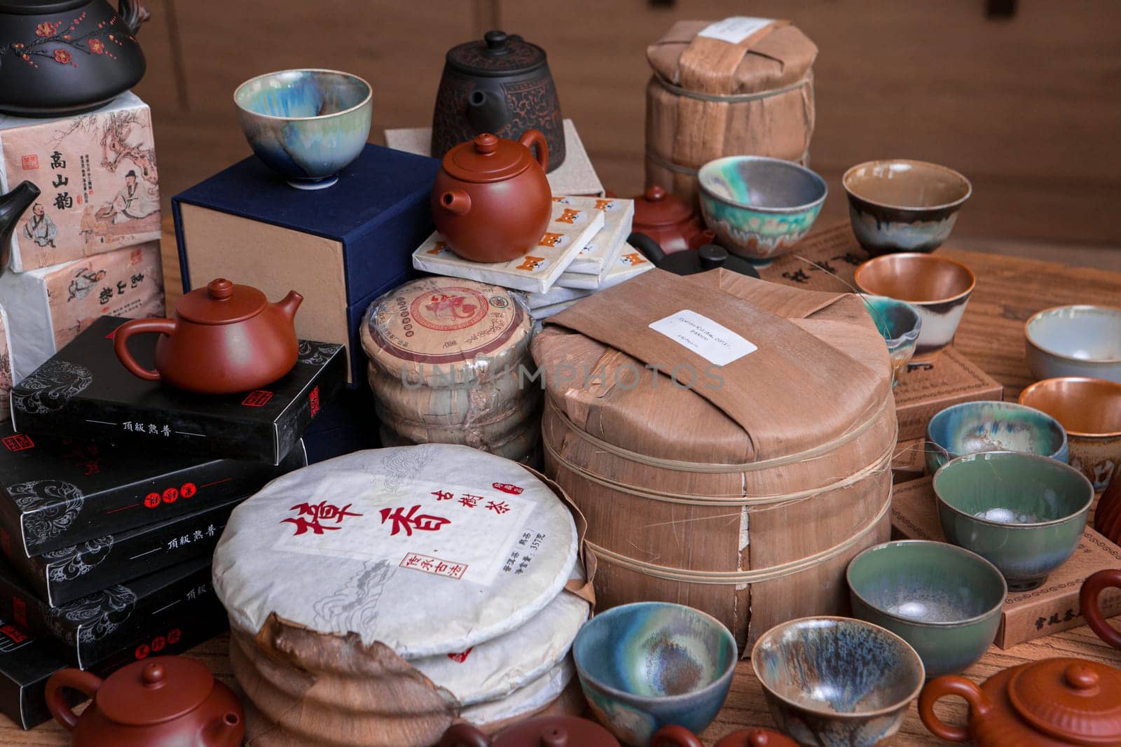 A beautiful collection of traditional tea sets and pottery, showcasing intricate designs and craftsmanship.