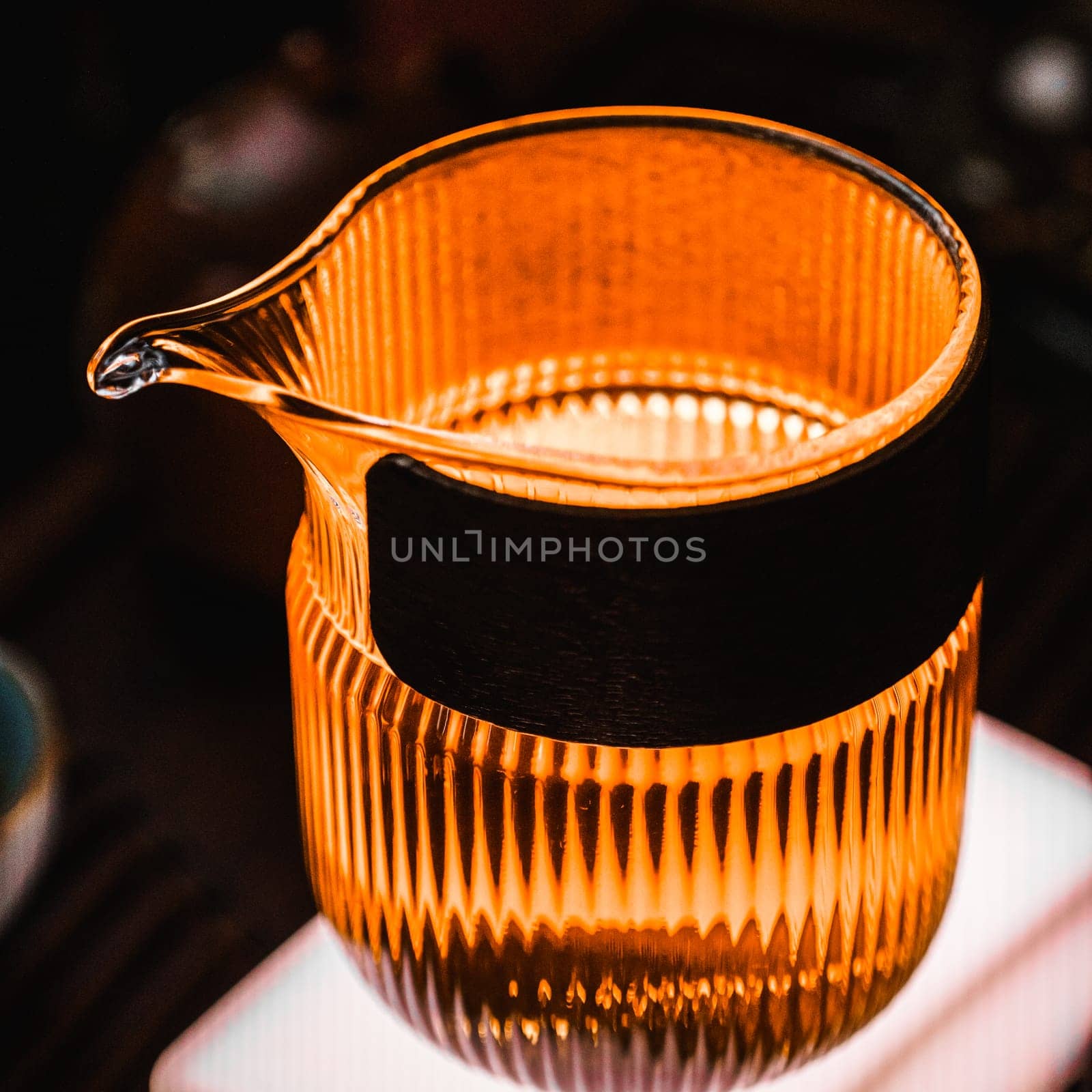 This amber pitcher with a textured surface is perfect for home decor and serving drinks at any event