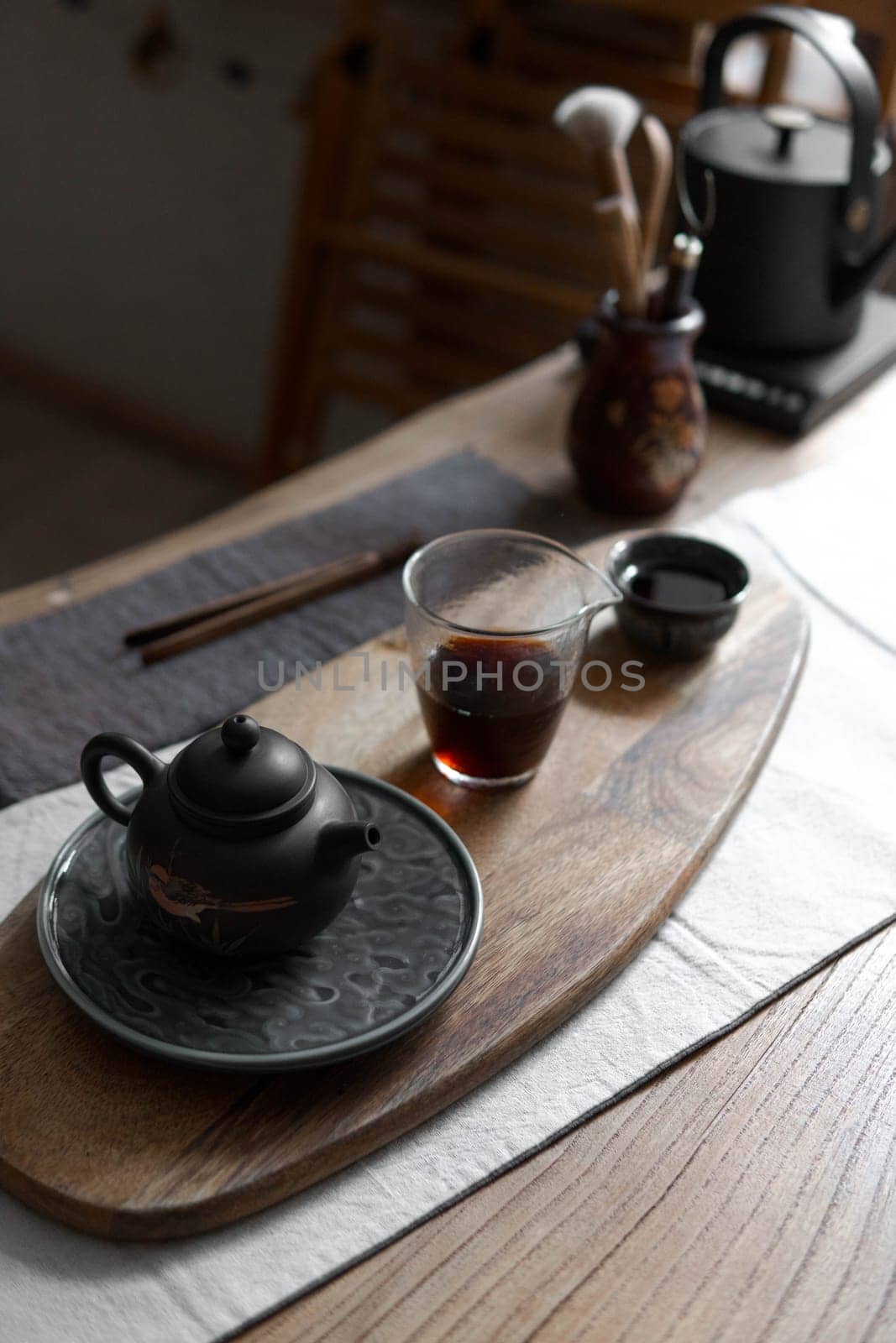 A beautifully arranged tea set on a wooden tray, showcasing tranquility and elegance in tea culture.