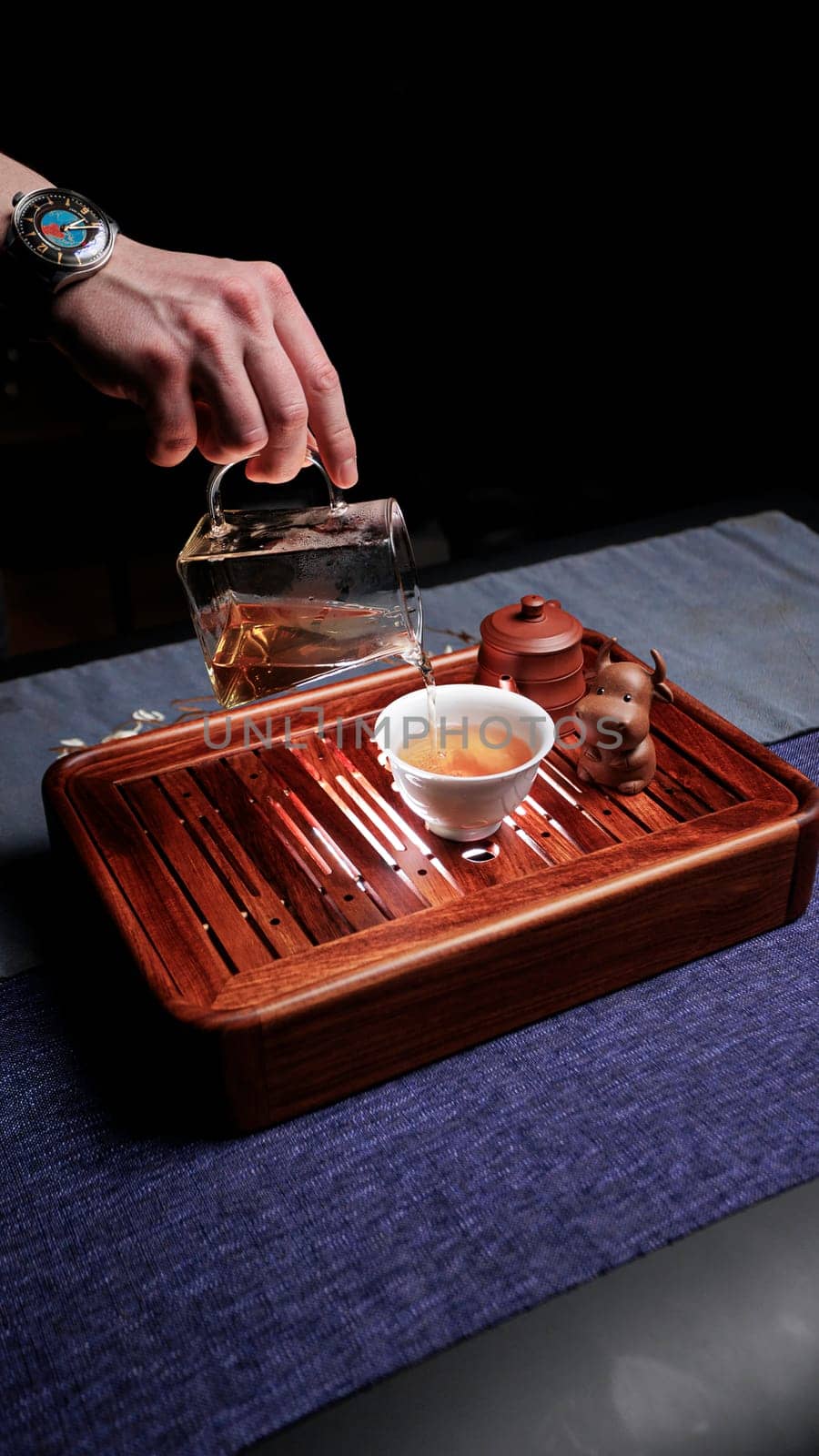 A beautifully serene scene of tea being poured, showcasing refined craftsmanship amid a tranquil ambiance