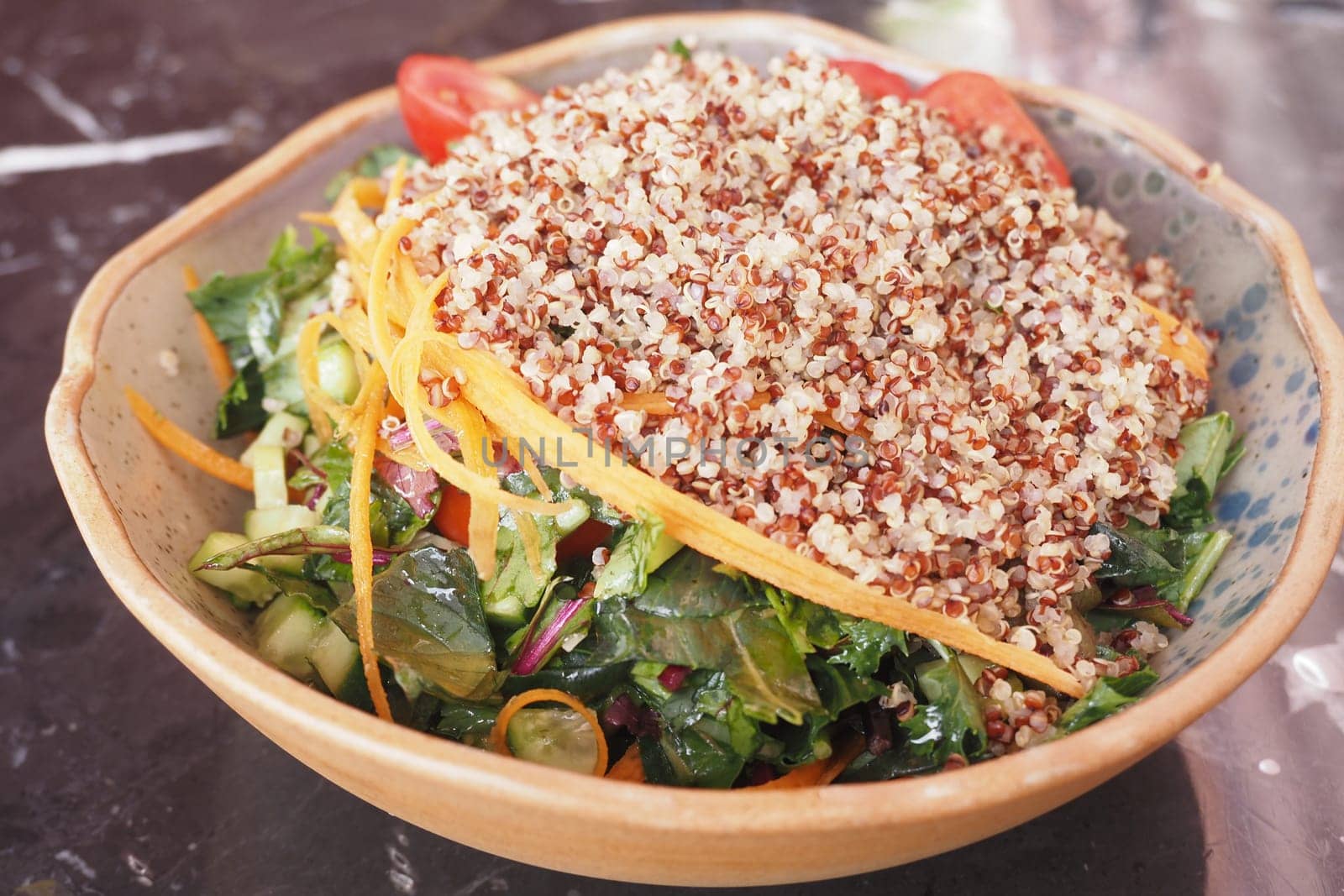 Healthy Salad Bowl with Fresh Vegetables and Quinoa Topping.