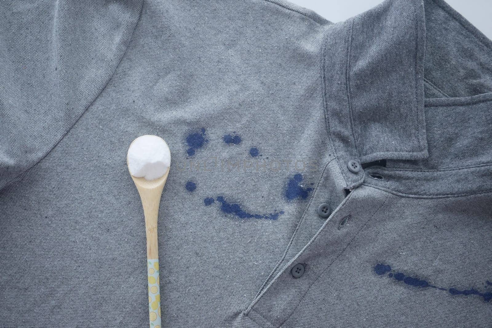 Baking soda on a shirt stain by ink