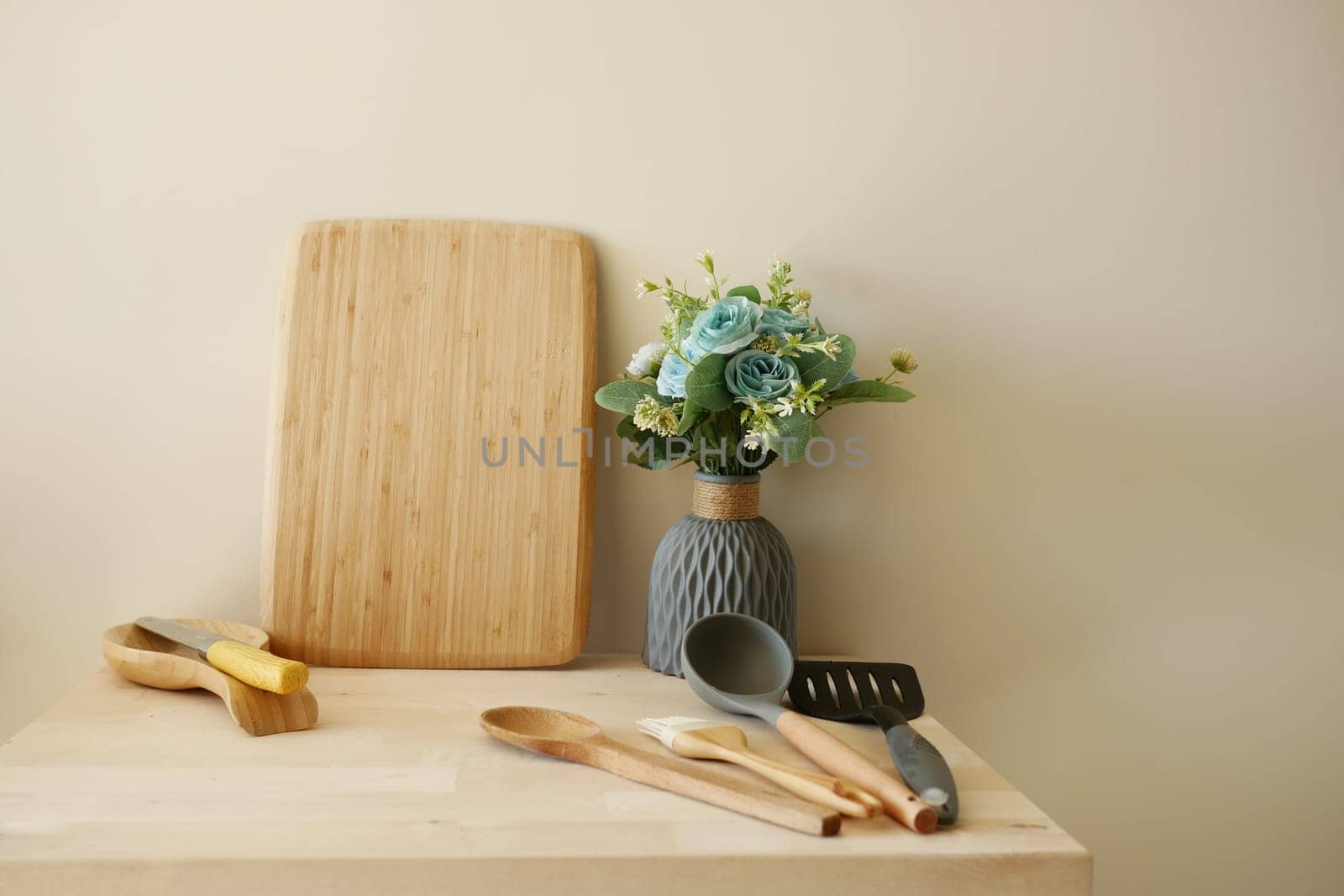A modern kitchen with contemporary utensils and an attractive floral centerpiece