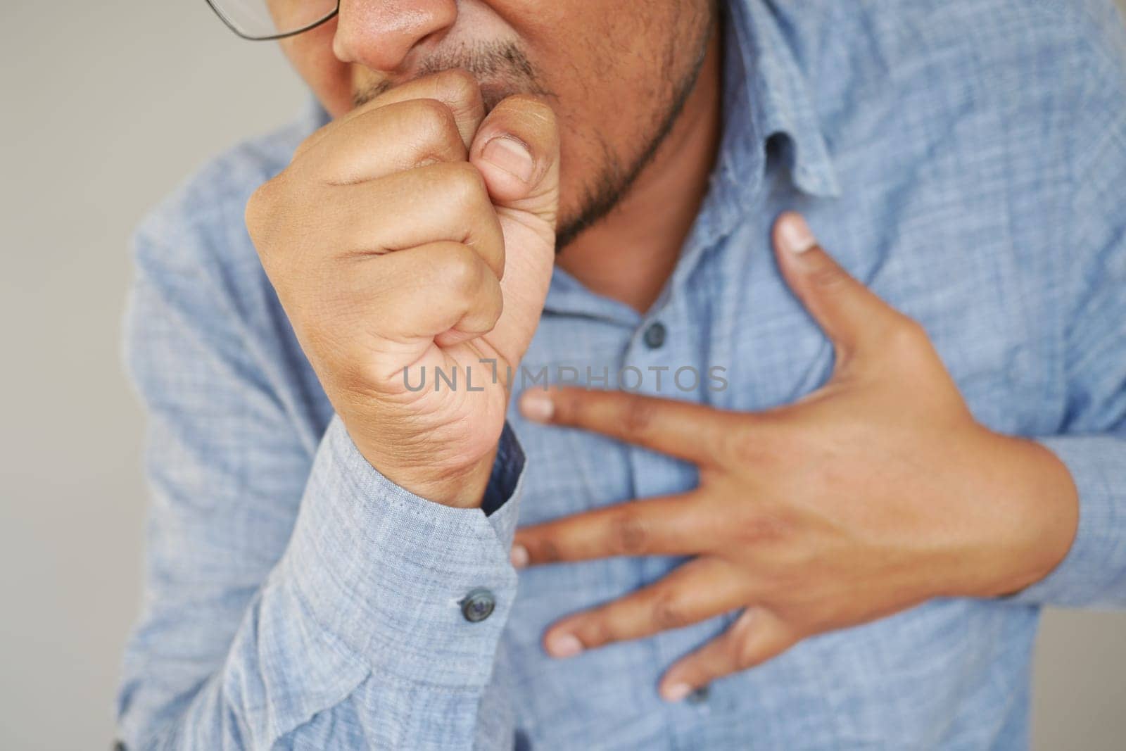 Sick man got flu allergy sneezing and blowing nose