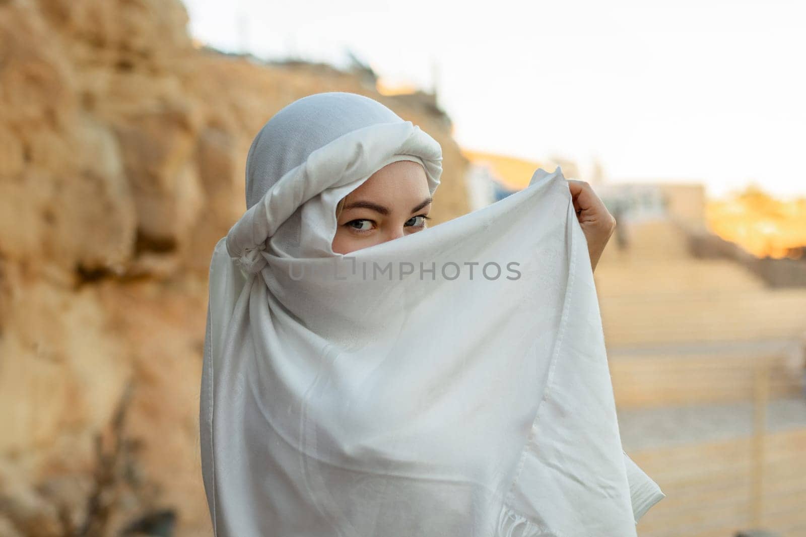 Portrait of a beautiful woman in Arabic clothing in Egypt during sunset