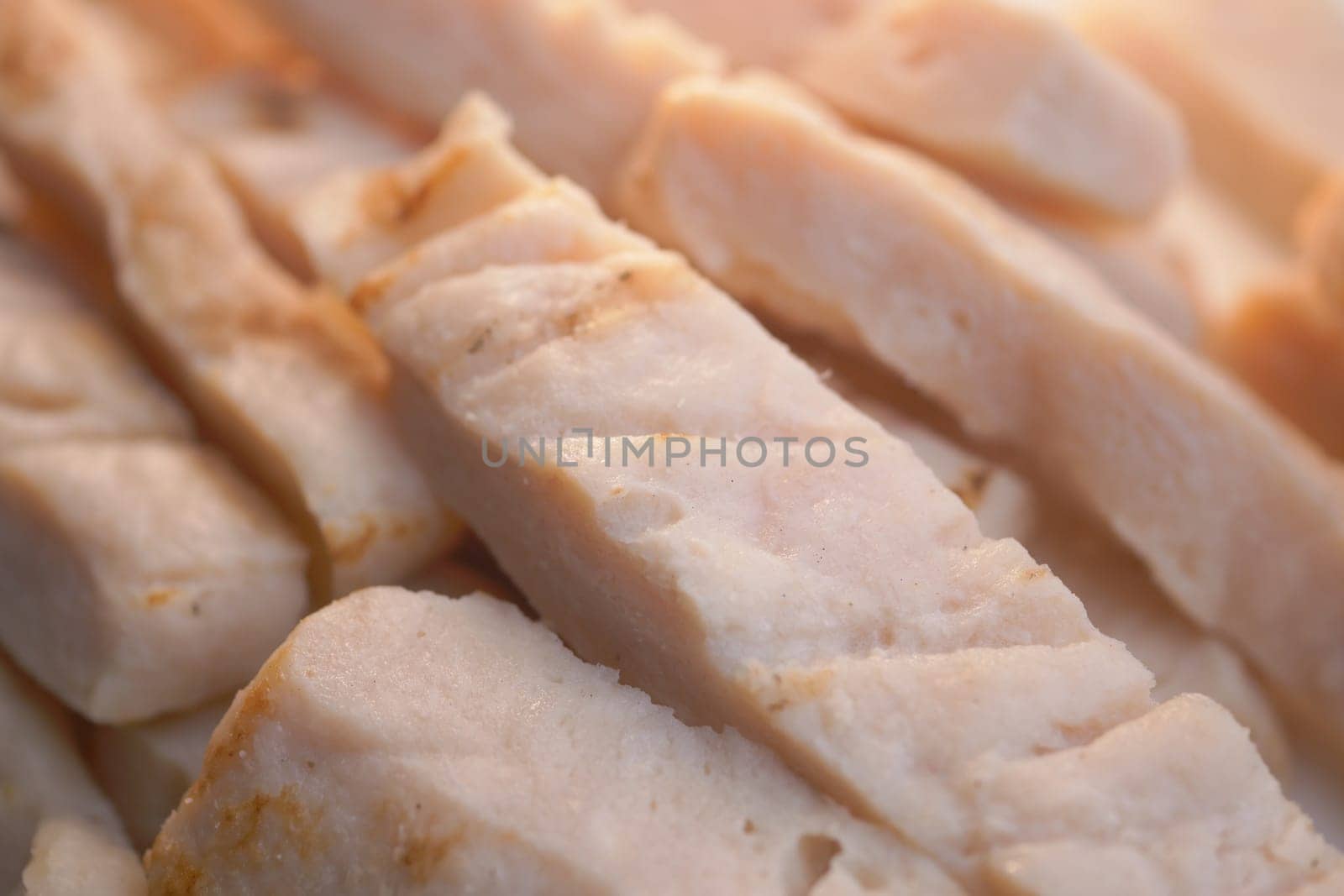 Freshly sliced cooked chicken breast showcasing its incredibly tender texture and flavor