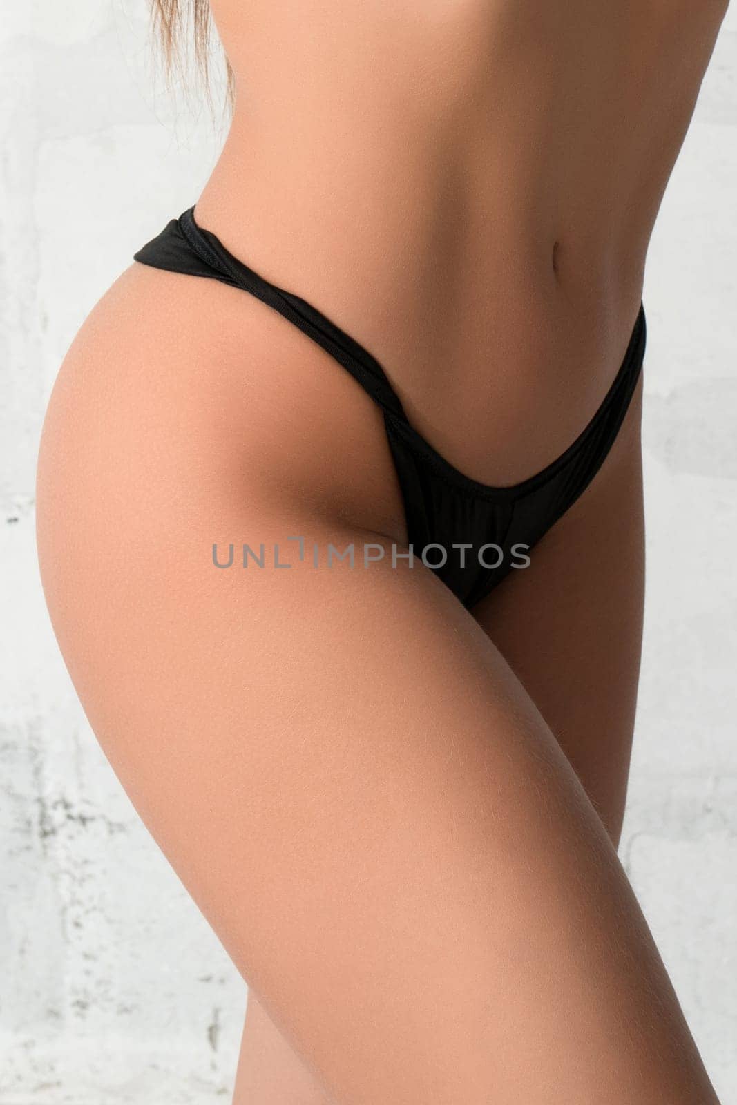 Gorgeous brunette wearing sexy top and black tanga portrait