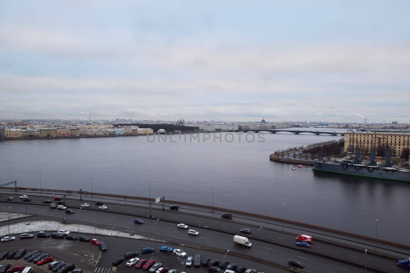 On a cloudy day, experience a breathtaking view of a scenic river beautifully surrounded by urban scenery