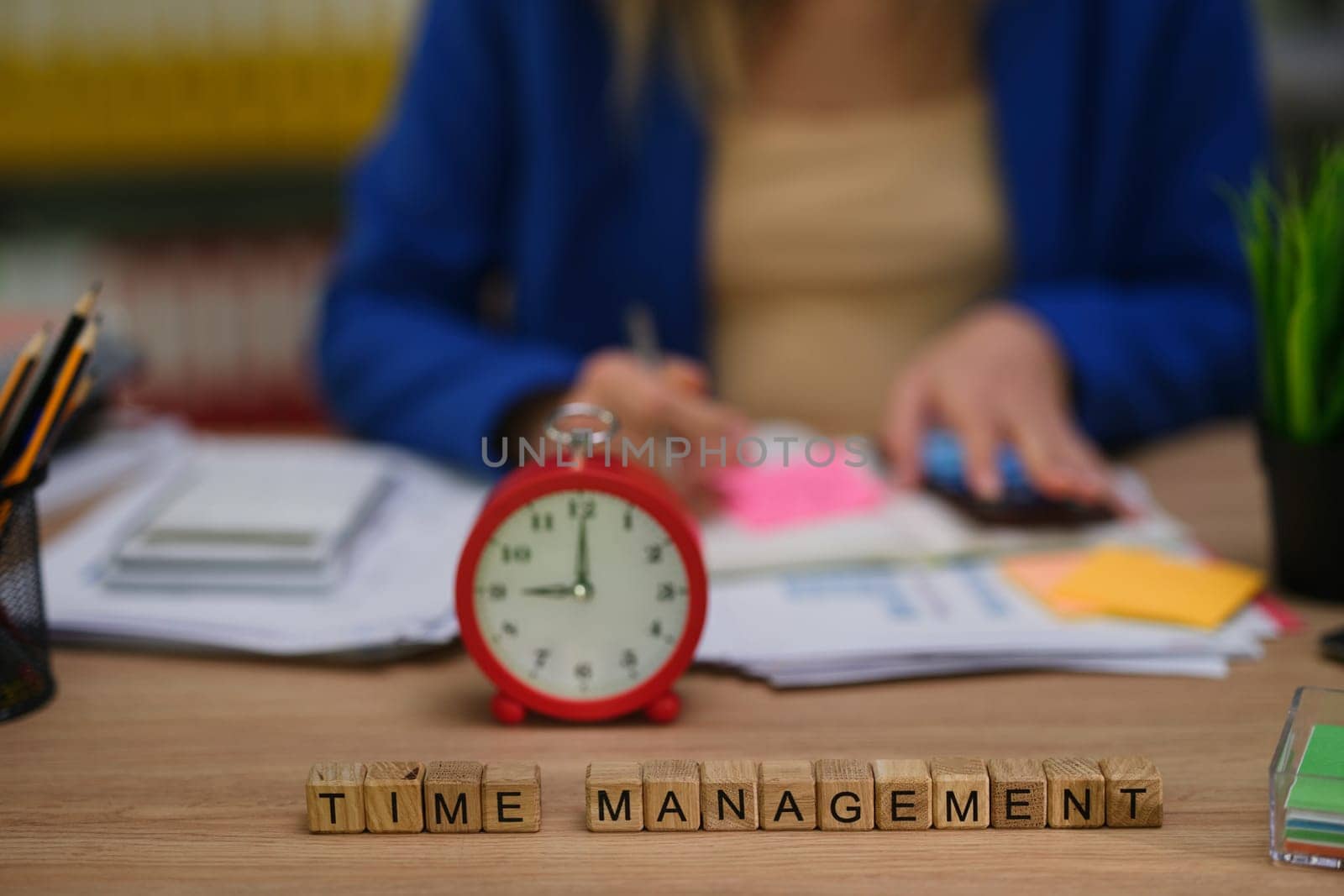 This illustration showcases effective time management through a clock alongside an organized and tidy workspace