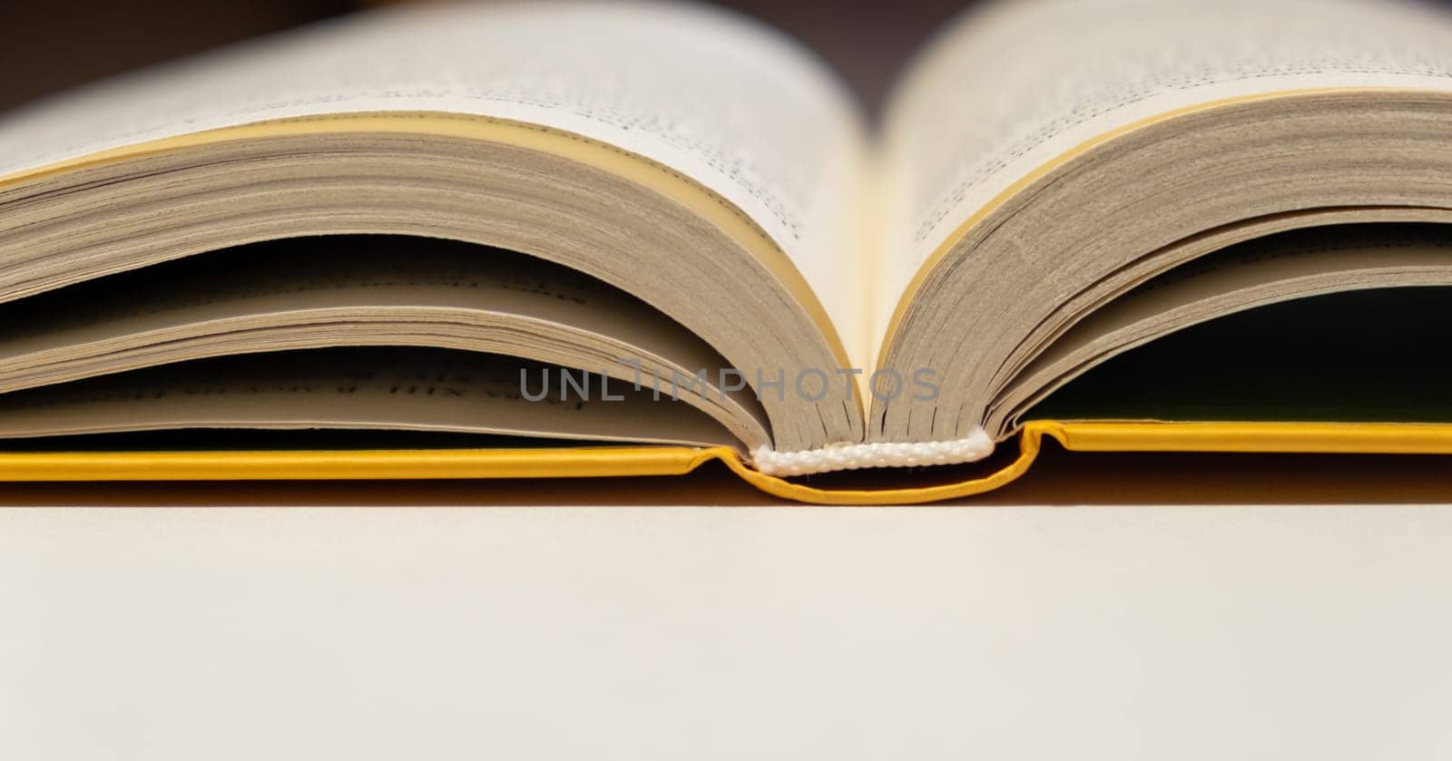 Open book close up. One book is yellow. by AnatoliiFoto