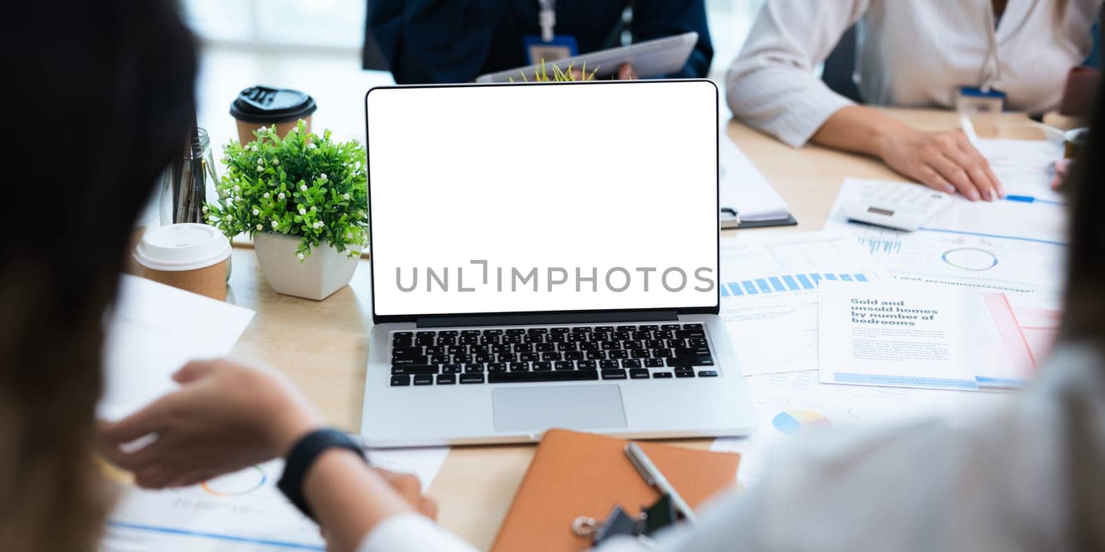 blank screen of man hand working on laptop computer and work while sitting at the table, mockup blank screen for product display or graphic design.