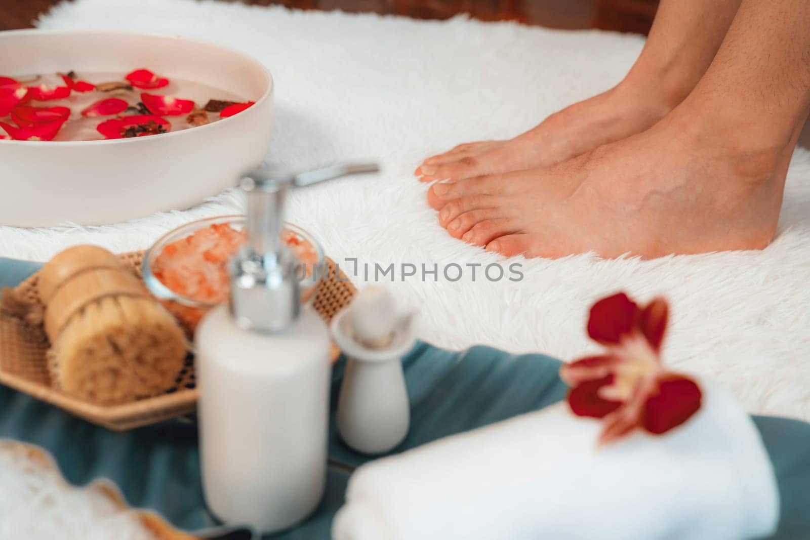 Woman indulges in blissful foot massage at luxurious spa salon. Quiescent by biancoblue