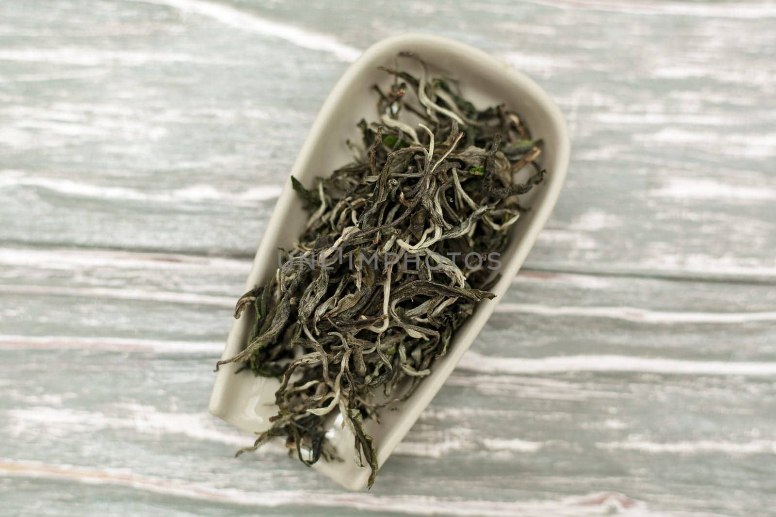 Dried tea leaves are elegantly displayed, making them perfect for all those who truly enjoy herbal tea