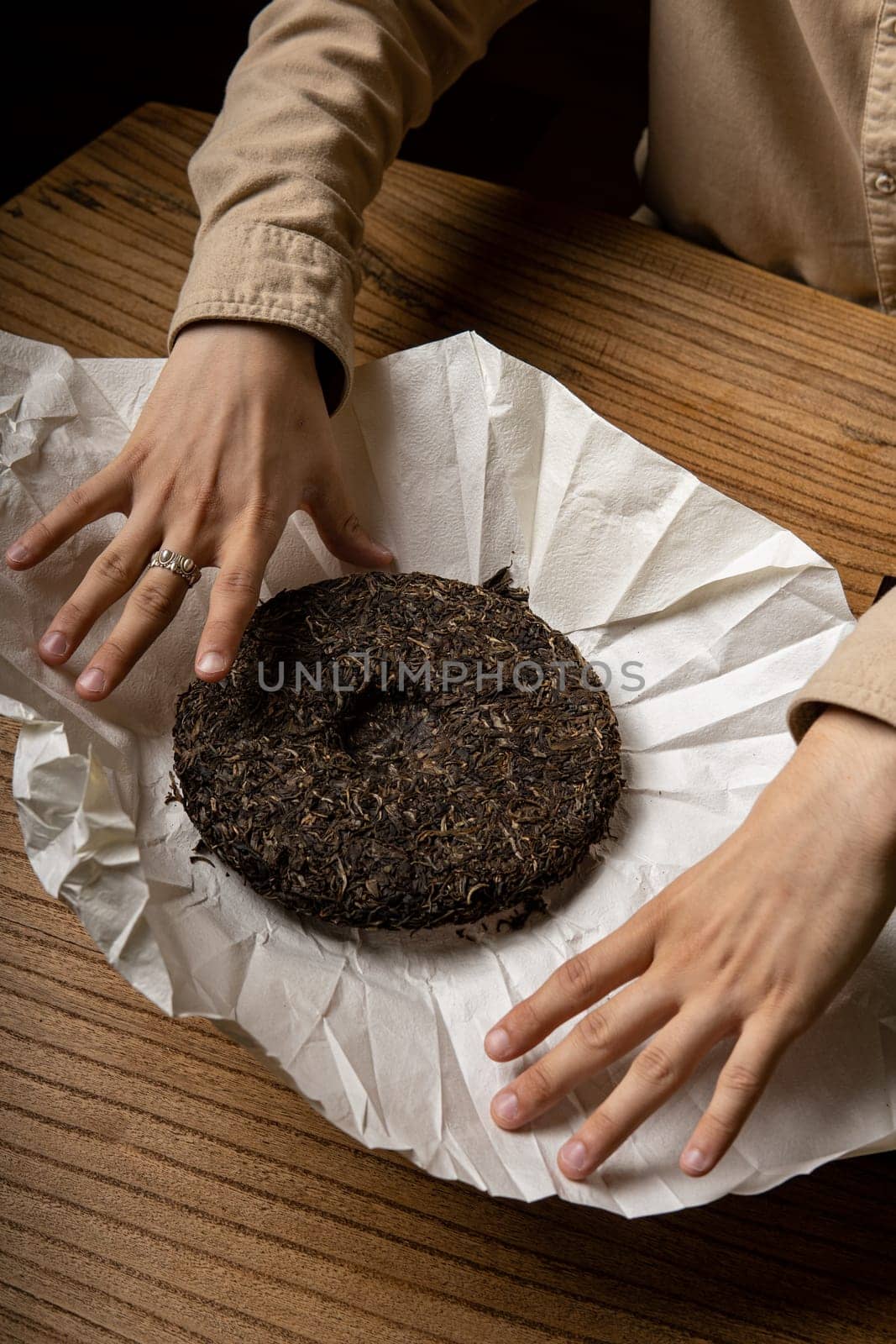This is a closeup view of a distinctive and unique fermented cake that is beautifully presented on parchment paper