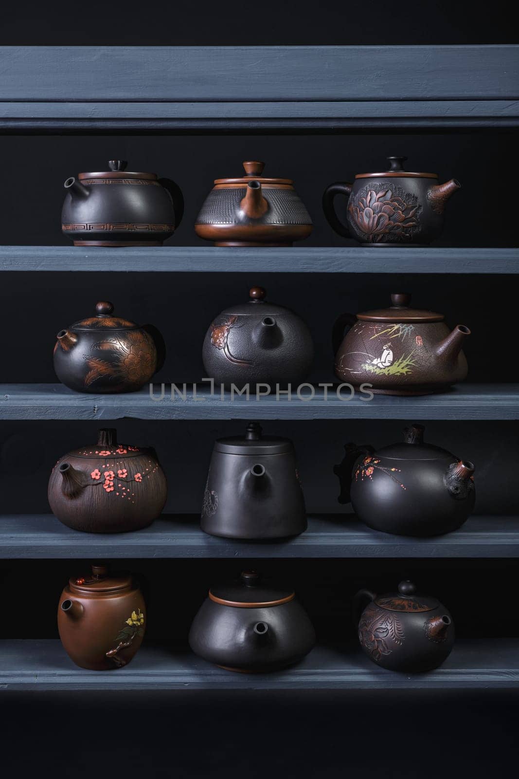 This is a stunning arrangement of uniquely designed teapots that showcase exquisite craftsmanship and artistic design