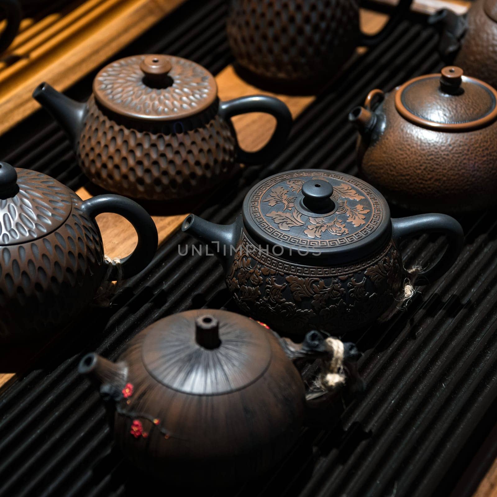 This stunning collection of intricately designed teapots showcases fine craftsmanship and rich tea culture