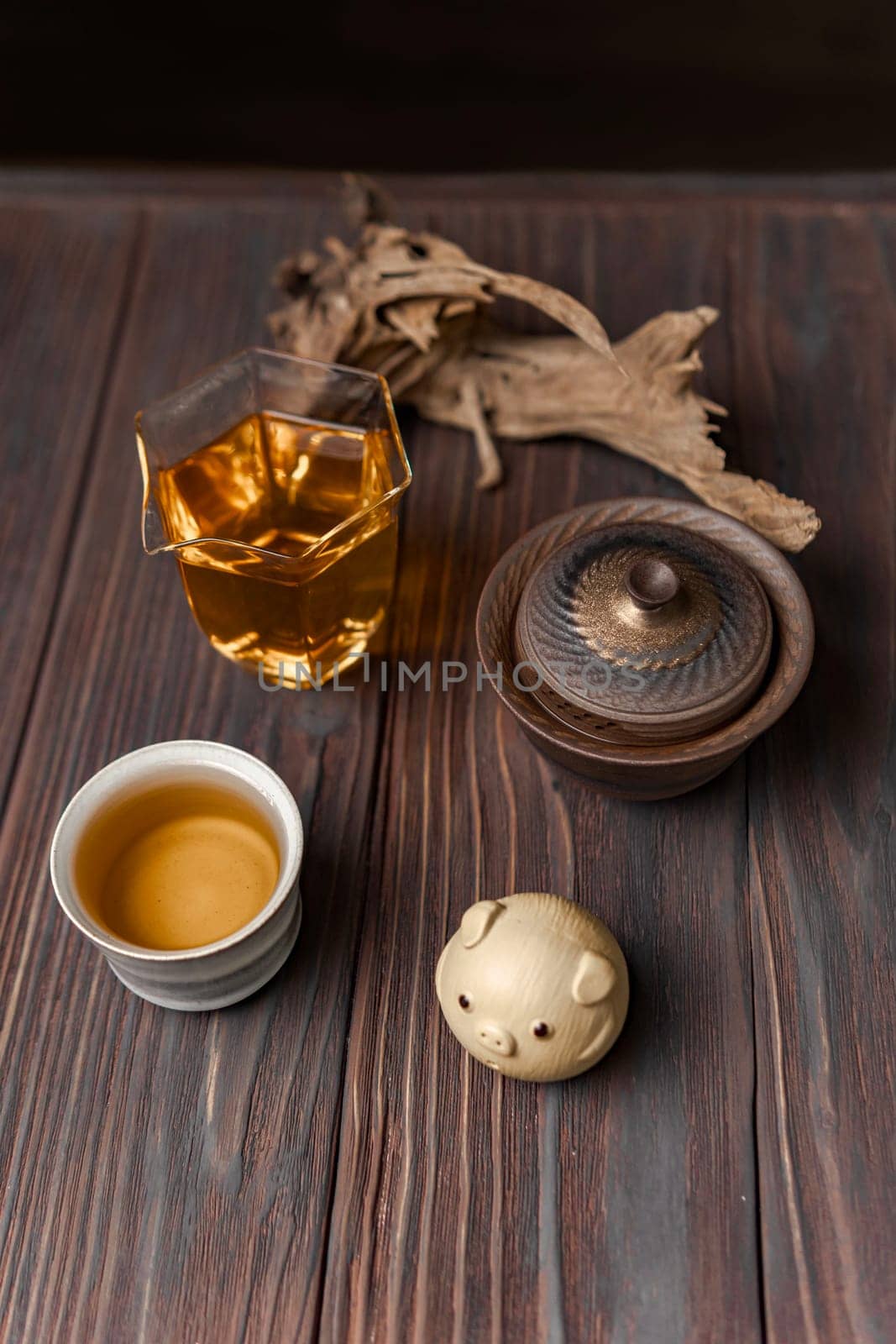 A beautifully tranquil tea setup showcasing elegant cups, a unique decorative piece, and soothing natural elements