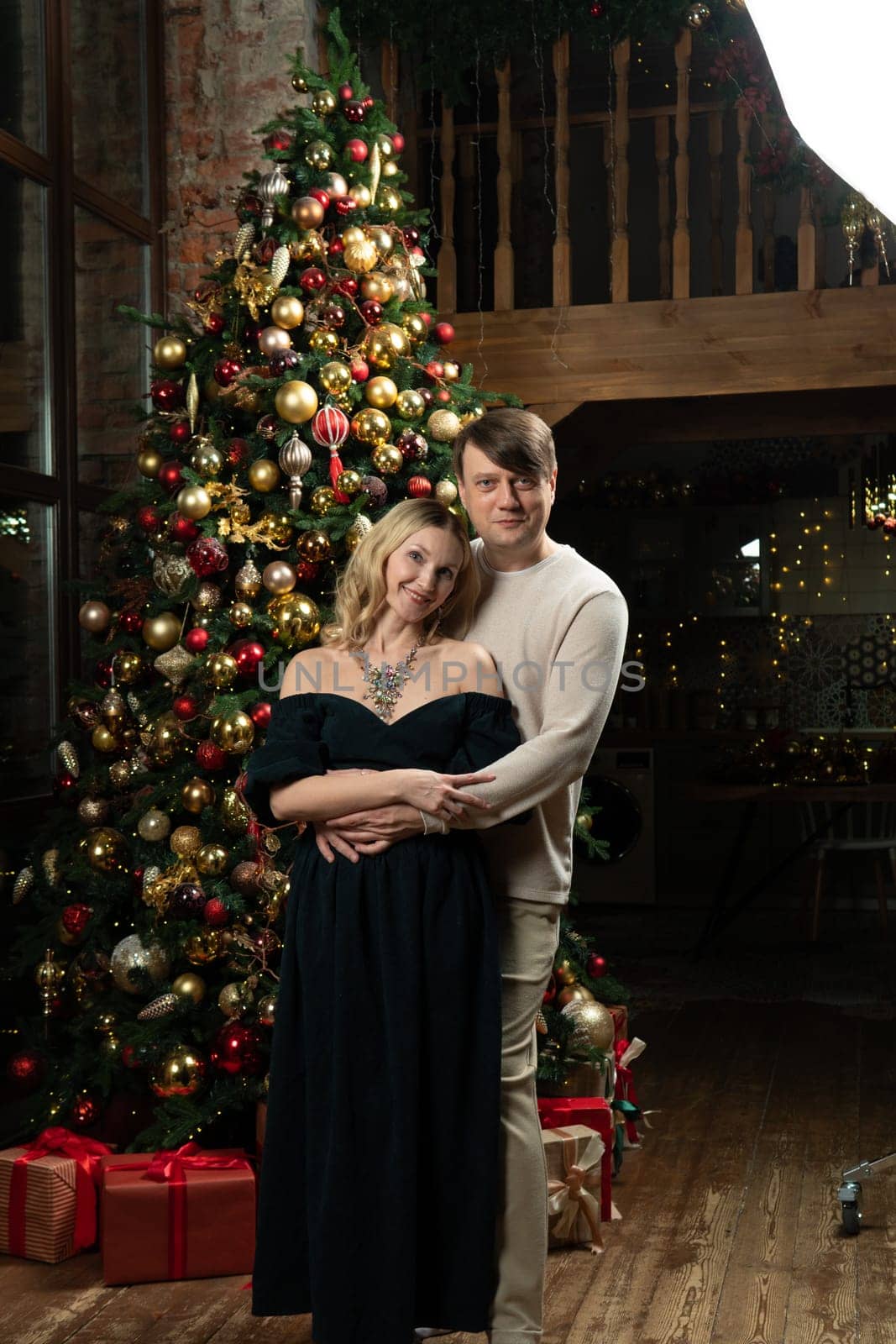 decoration christmas joy december family man tree happiness smiling woman winter celebration