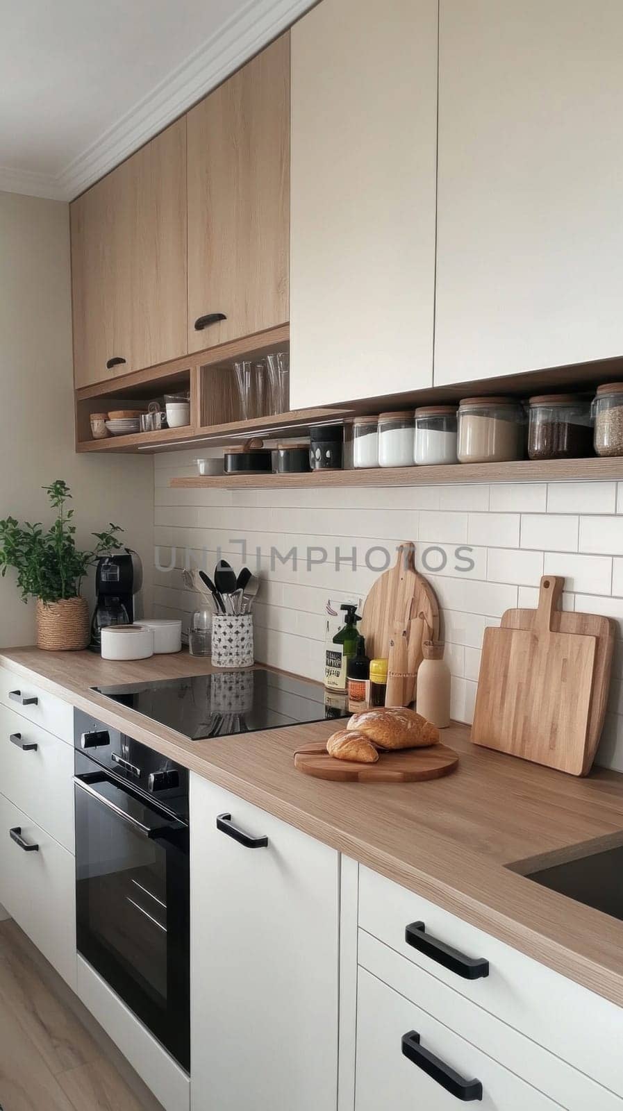 Stylish and contemporary kitchen design featuring wooden countertops, white cabinets, and a modern oven