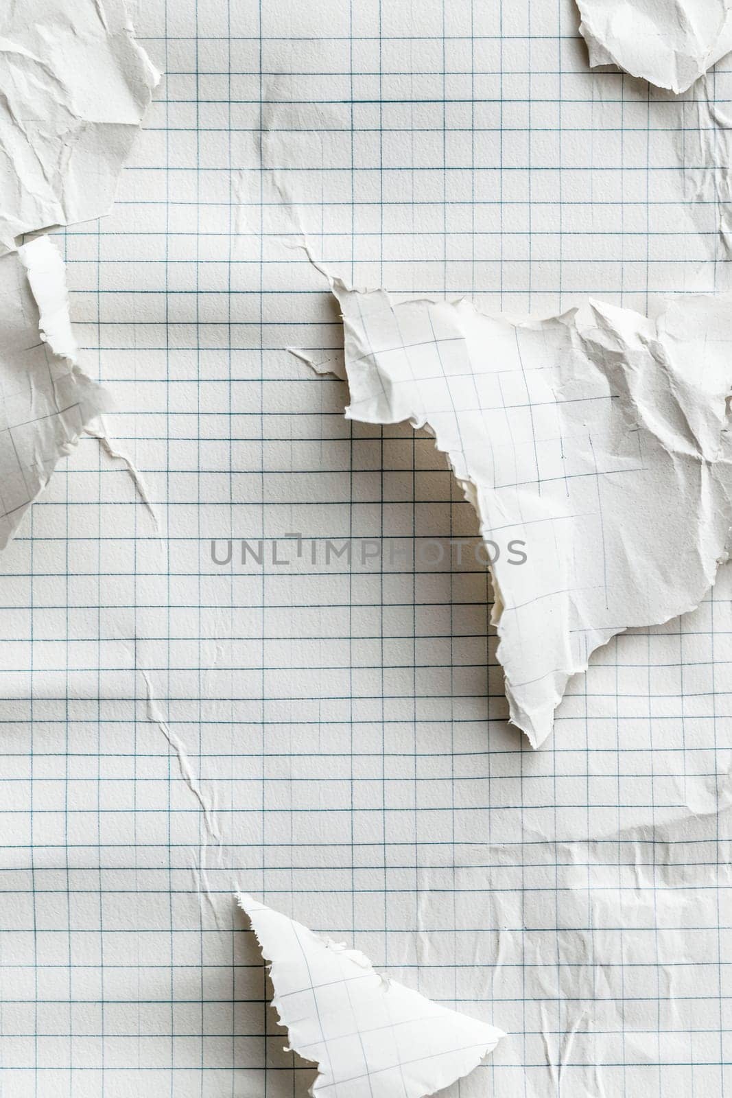 High-resolution image of layered torn notebook paper sheets, showcasing visible creases and fibers. ideal for educational materials, stationery, or creative branding projects, offering a textured and authentic paper background.