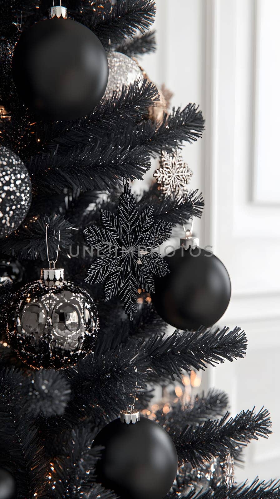 Elegant black and silver Christmas tree decorations.