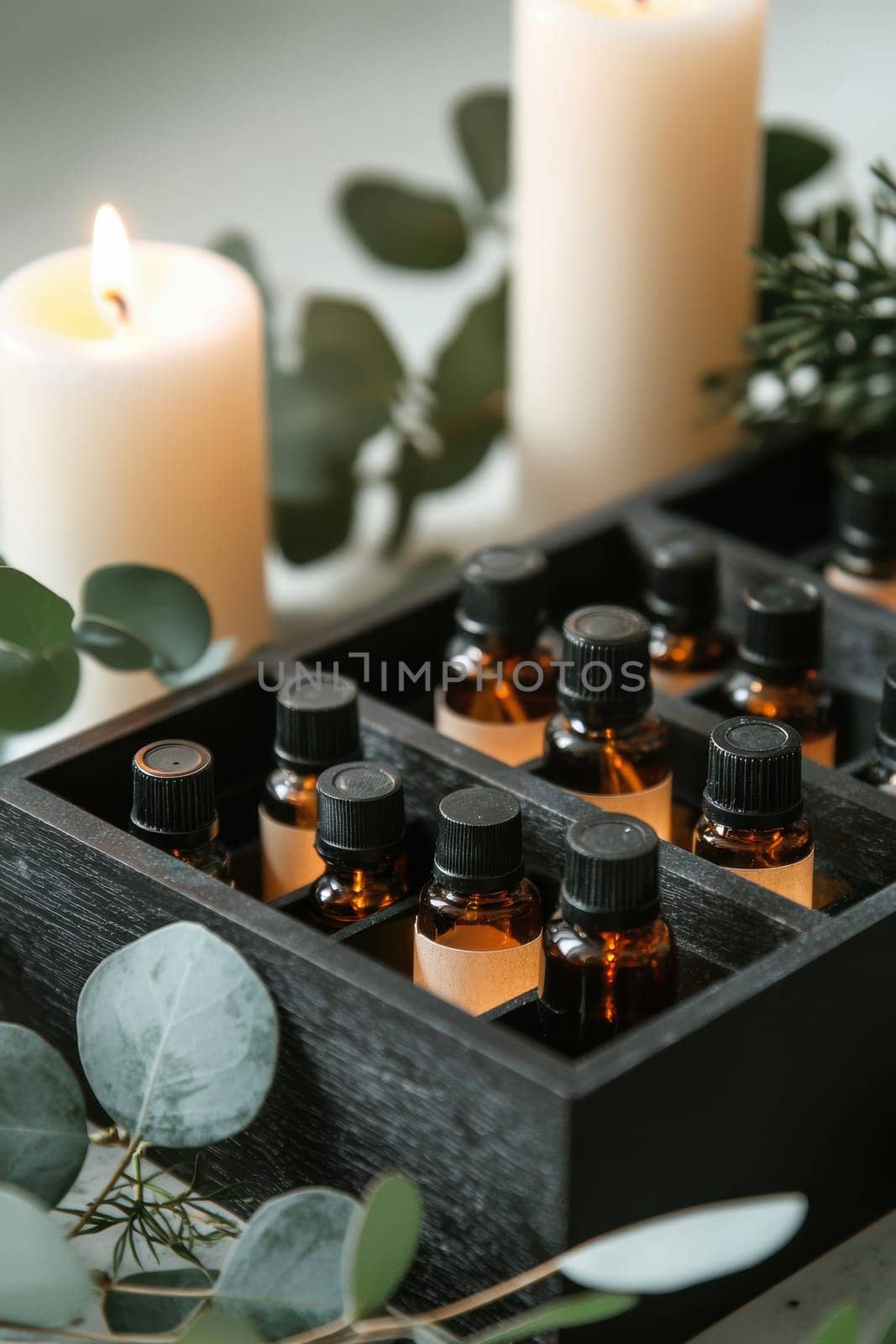 A wooden advent calendar showcases small compartments with premium essential oil bottles. the serene display is complemented by eucalyptus leaves, candles, and a soothing spa-like ambiance, perfect for promoting wellness during the holiday season.