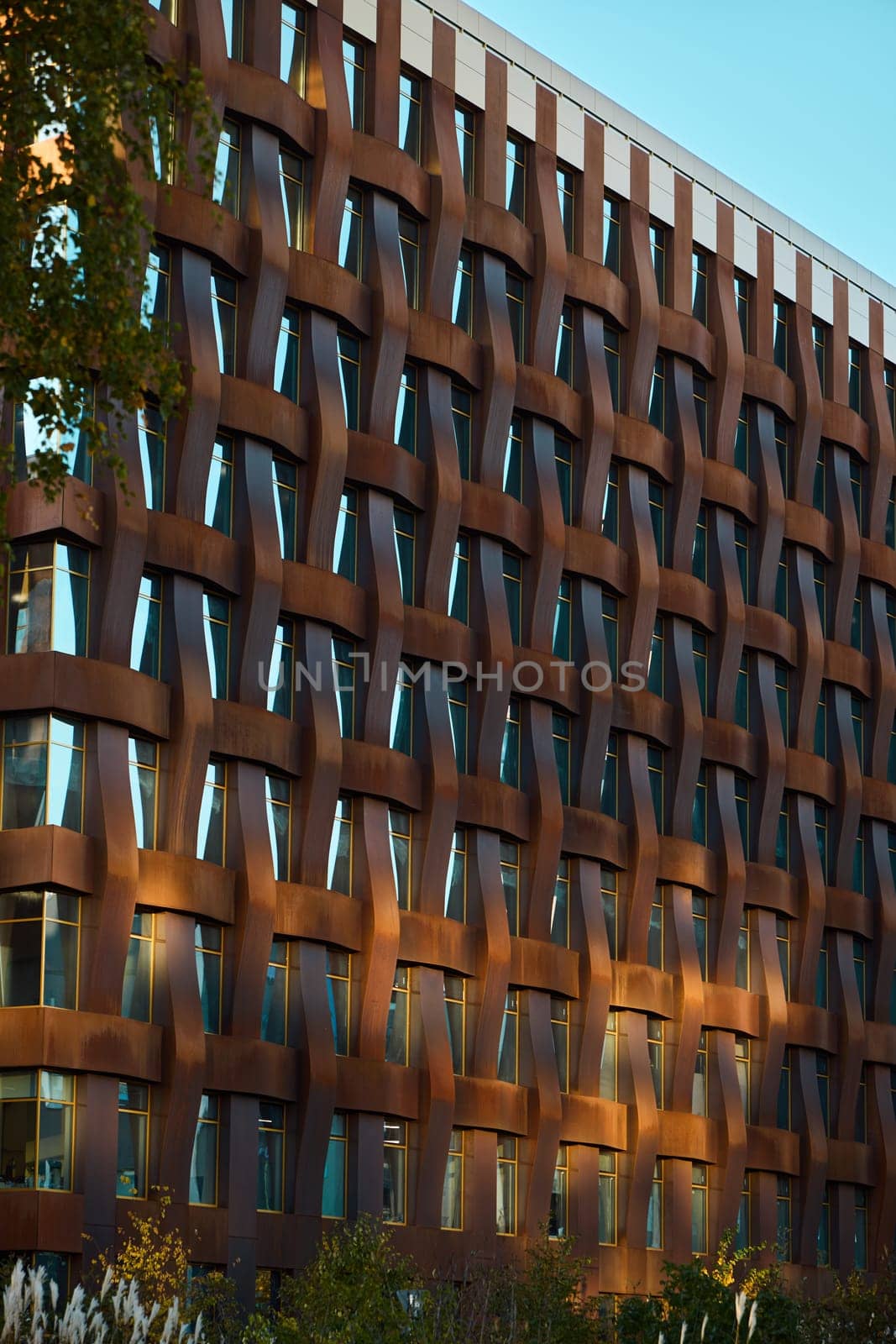 An eyecatching modern building facade showcasing intricate and captivating patterns along with diverse textures