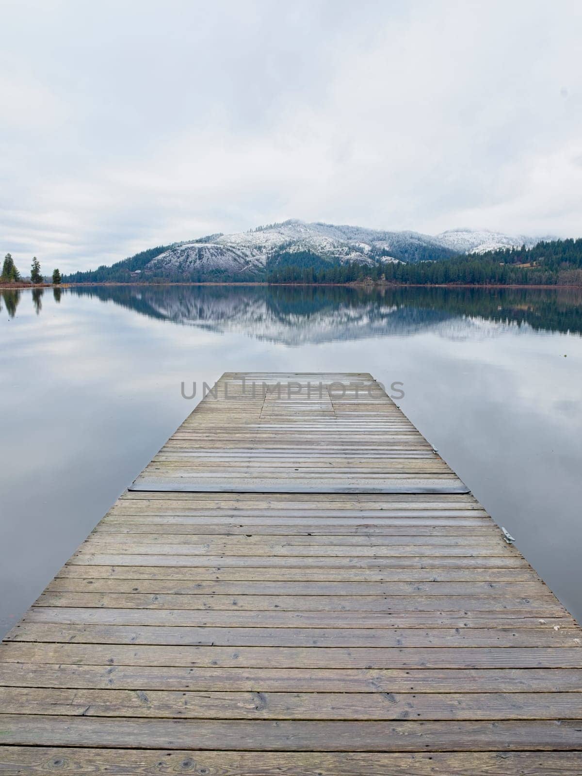 Looking out from the dock at the calm Rose Lake in north Idaho.
