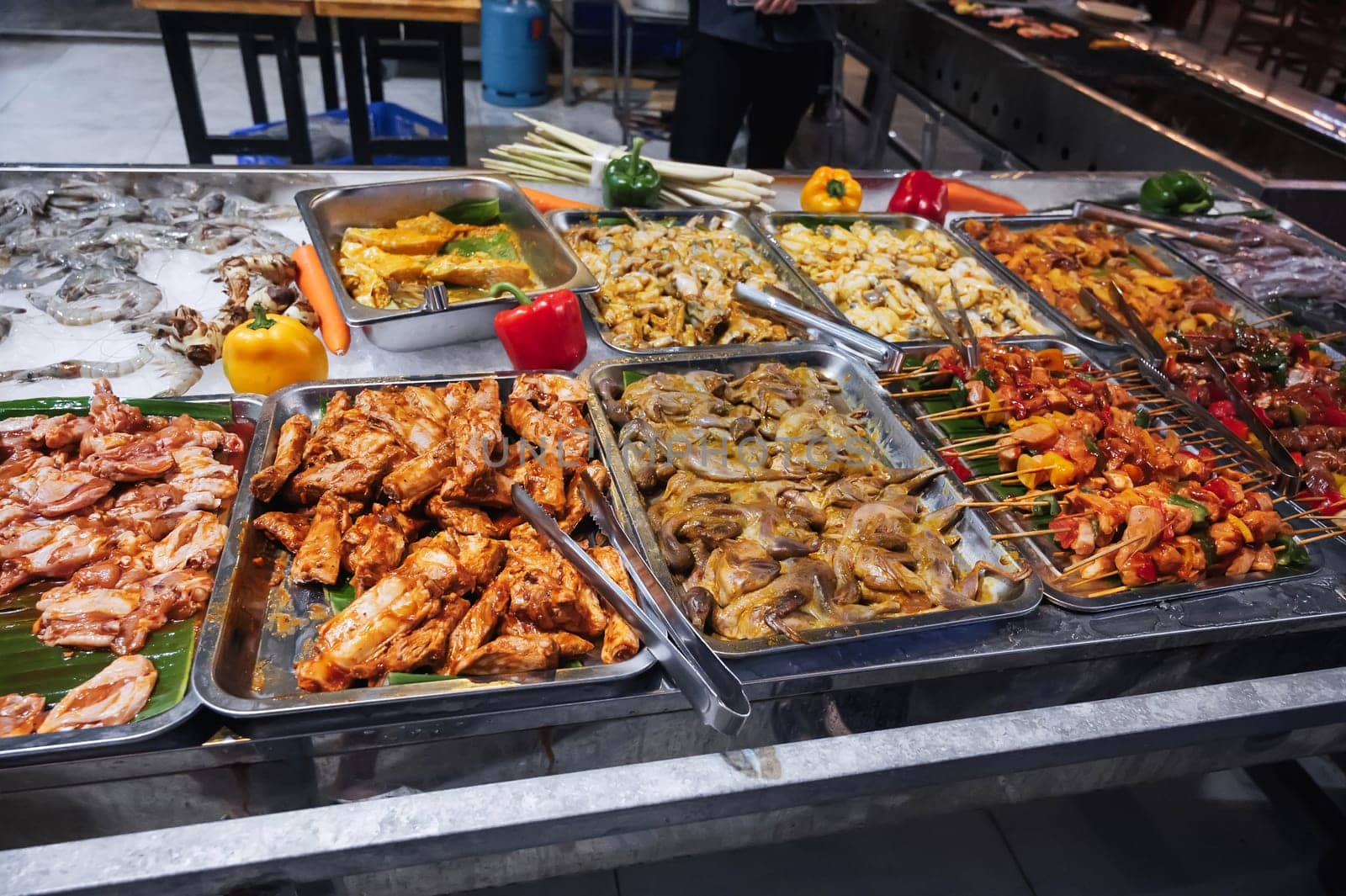 The street market offers a wide range of fresh meat for barbecue