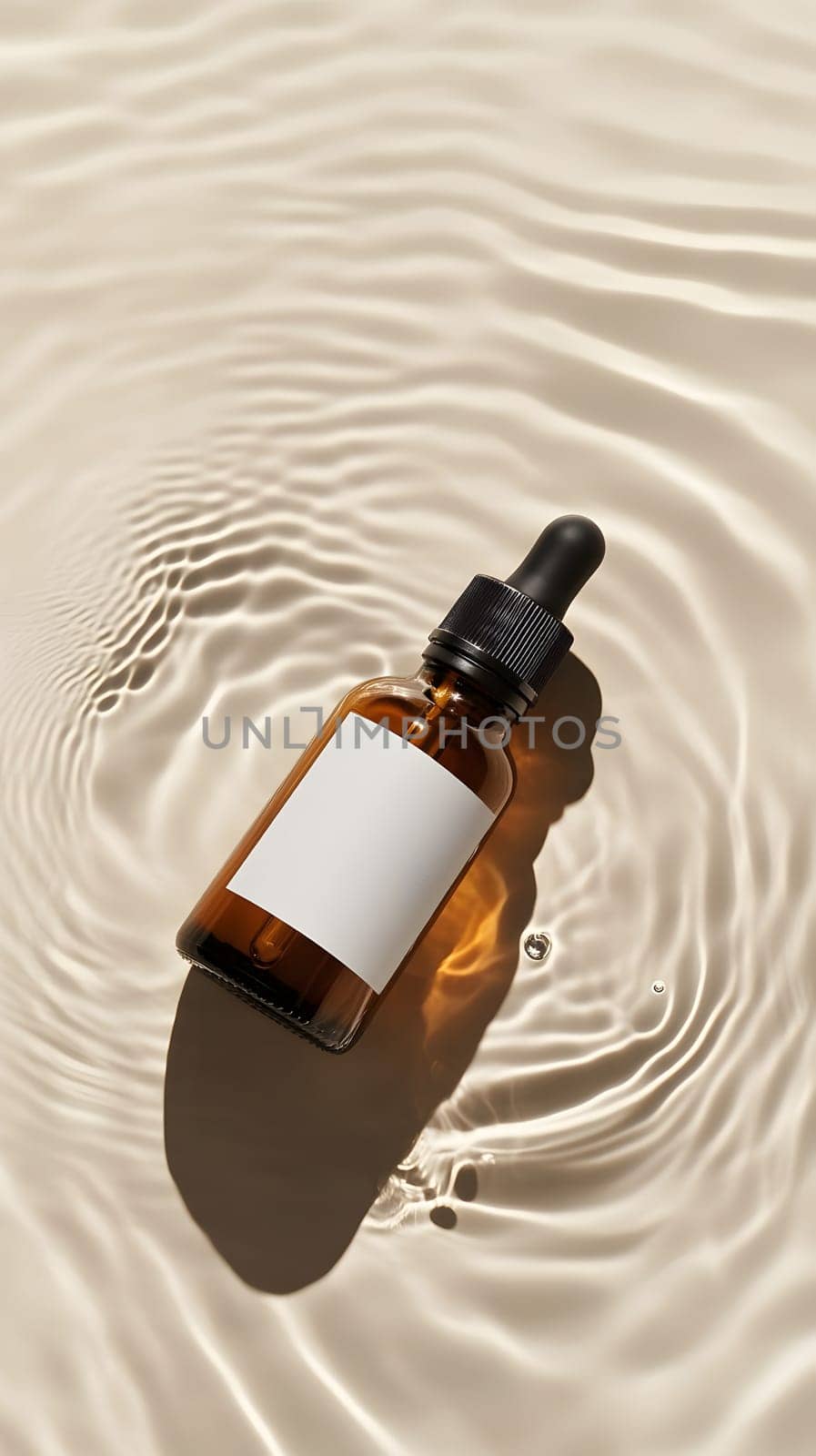 A brown glass dropper bottle on rippling water surface.