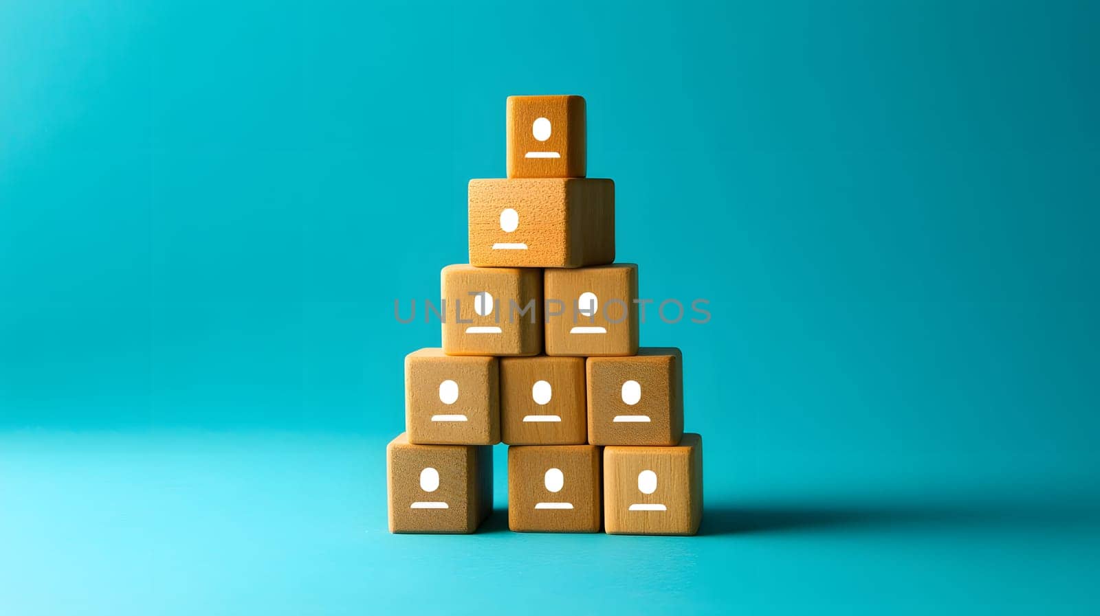 Stacked blocks with icons representing people on a blue background.