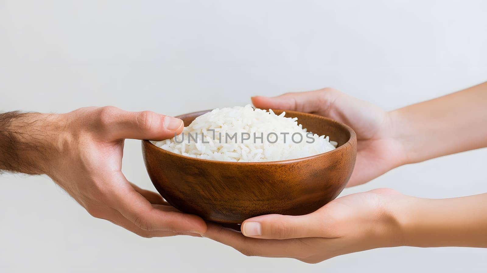Two hands exchanging a bowl of rice, symbolizing sharing and generosity.