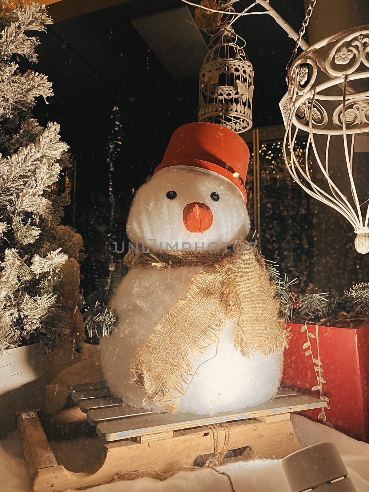 Aesthetic Warm Vintage Shop Window Photo with Snowman for Christmas. High quality photo