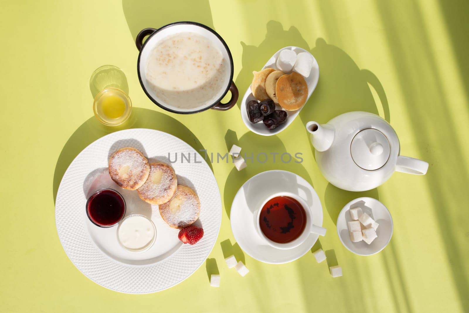 Healthy breakfast . Porridge, cheesecakes and tea top view.