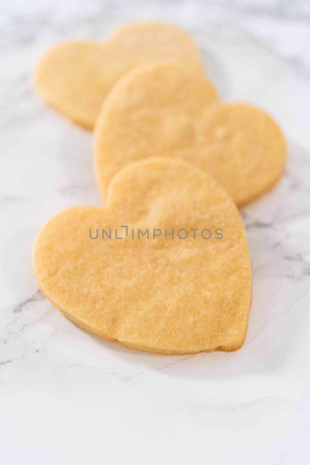 Heart-shaped sugar cookies with royal icing by arinahabich