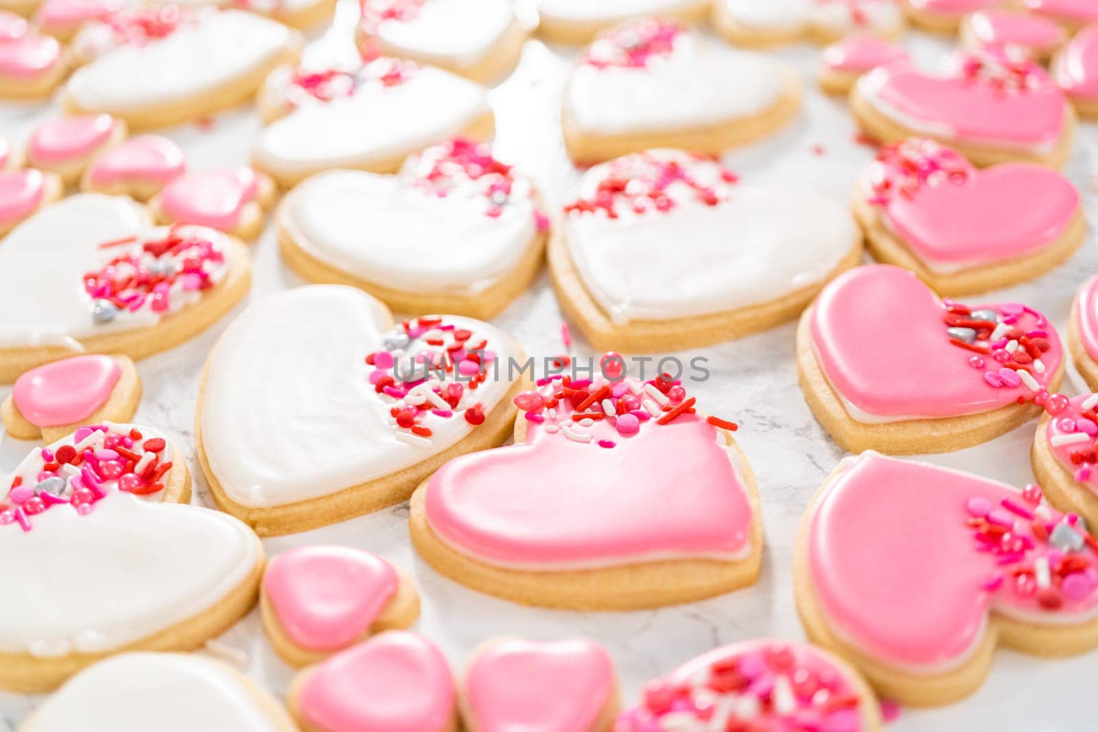 Heart-shaped sugar cookies with royal icing by arinahabich