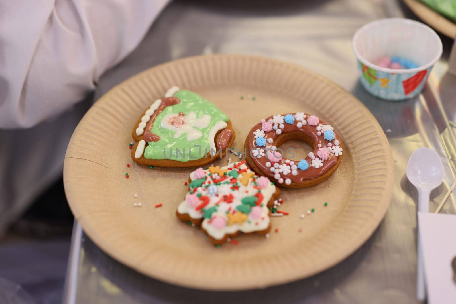 These colorful holiday cookies are nicely decorated on a charming plate, perfect for festive gatherings