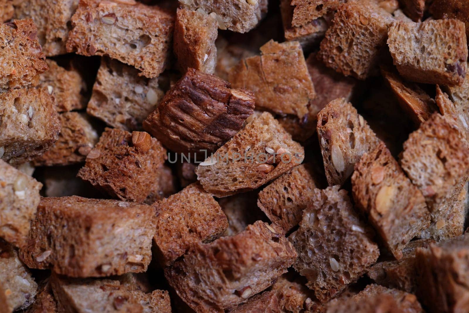 Closeup of delicious brown bread croutons, ideal for enhancing salads, soups, and various toppings