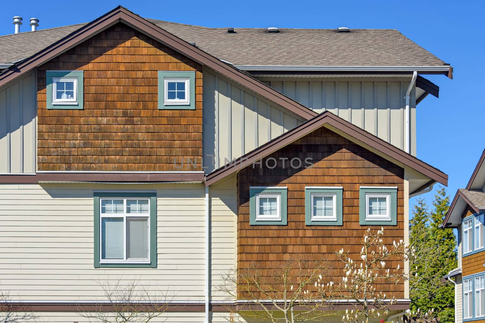 Top of residential townhouse on a bright spring day.