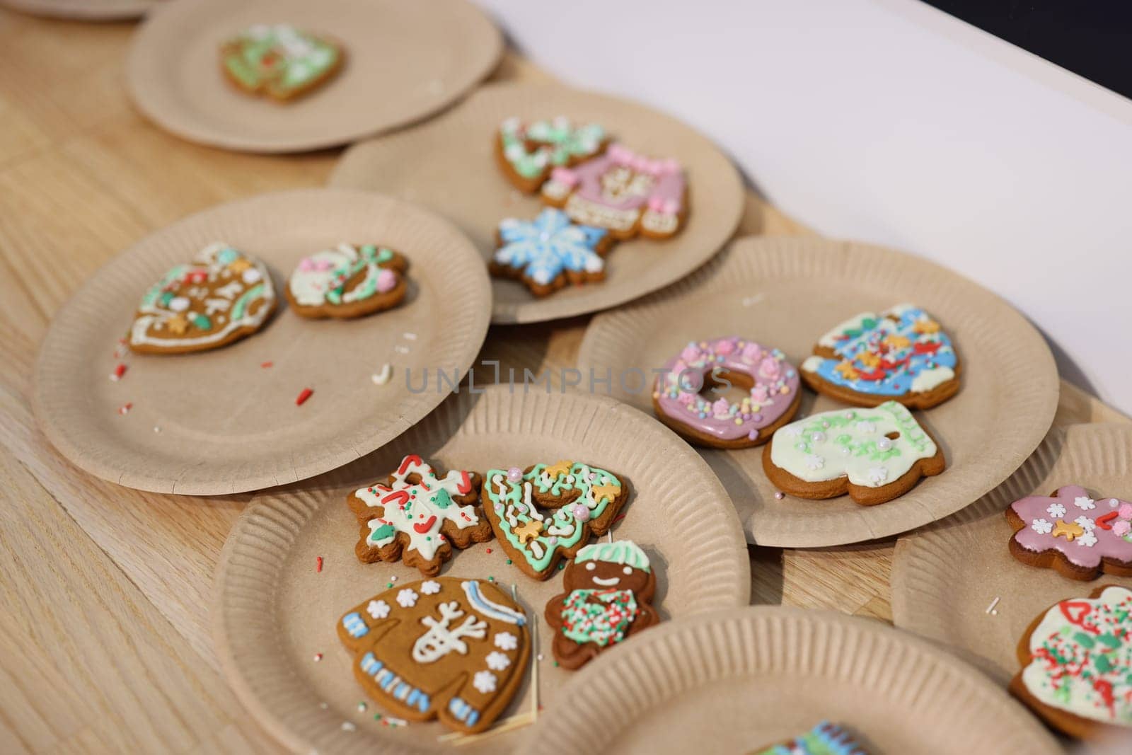 Colorful holiday cookies beautifully arranged on decorative plates, ideal for celebrating festive seasonal occasions