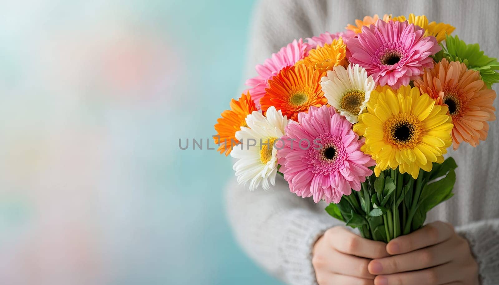 A person holding bouquet of colorful birthday flowers, expressing joy and celebration