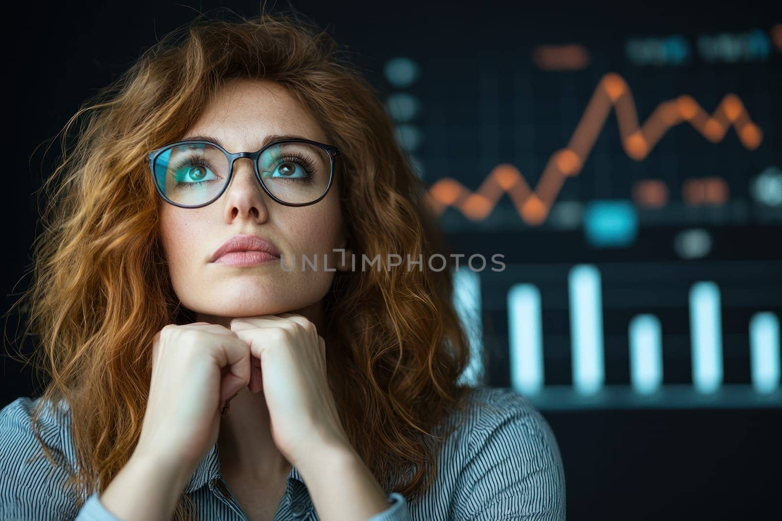 A Thoughtful businesswoman analyzing charts and data trends with focus