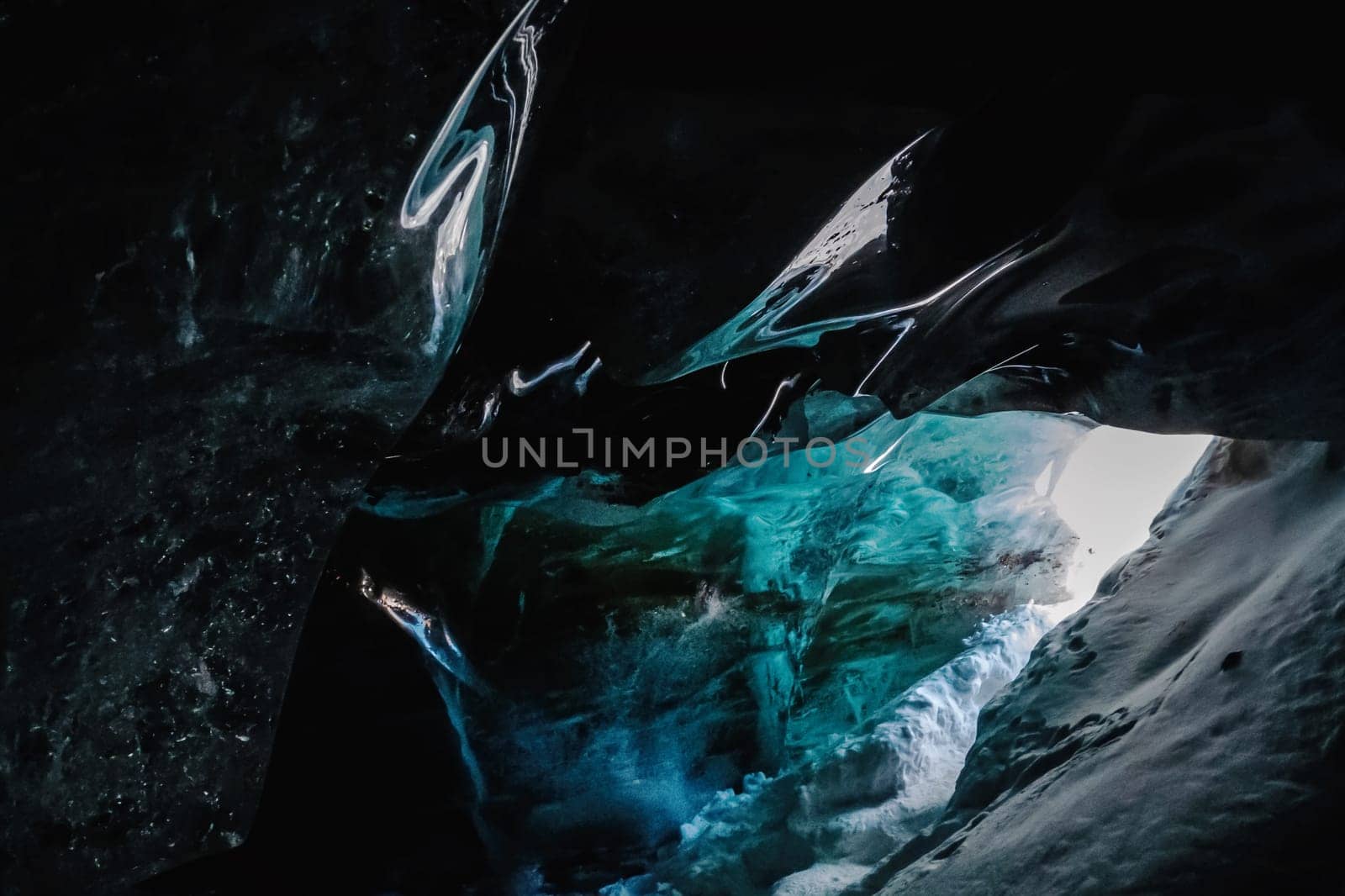 Ice cave: Entrance Near Bogdanovich Glacier, Tian Shan Mountains, Central Asia, Almaty, Kazakhstan's National Park, Zailiysky Alatau Natural Wonders.