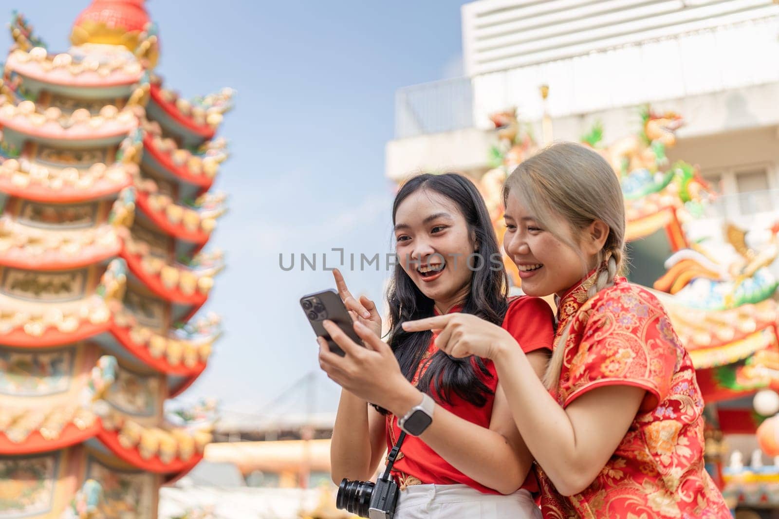 Tourists immerse themselves in the lively celebrations of Chinese New Year capturing joyful moments.
